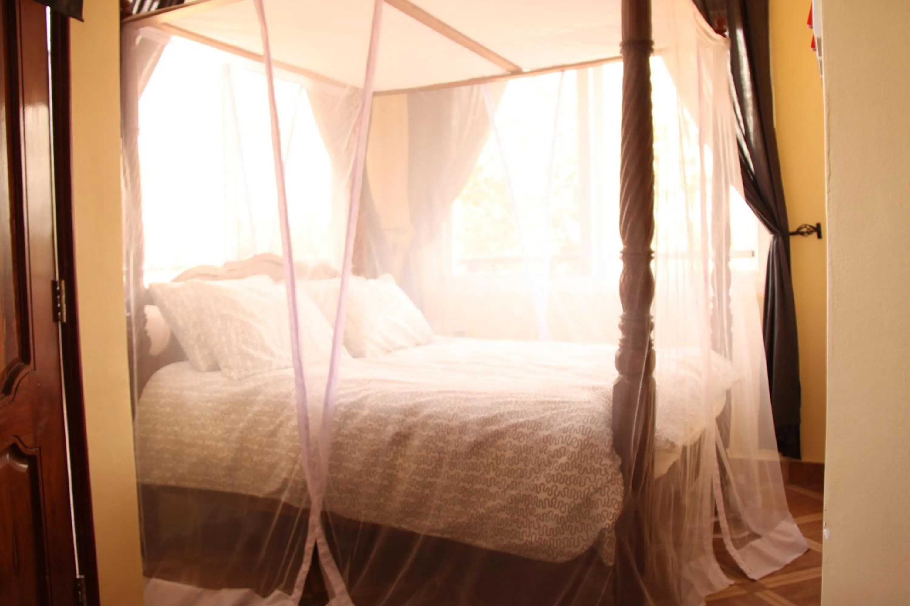 Bed in East Point Hotel Moshi