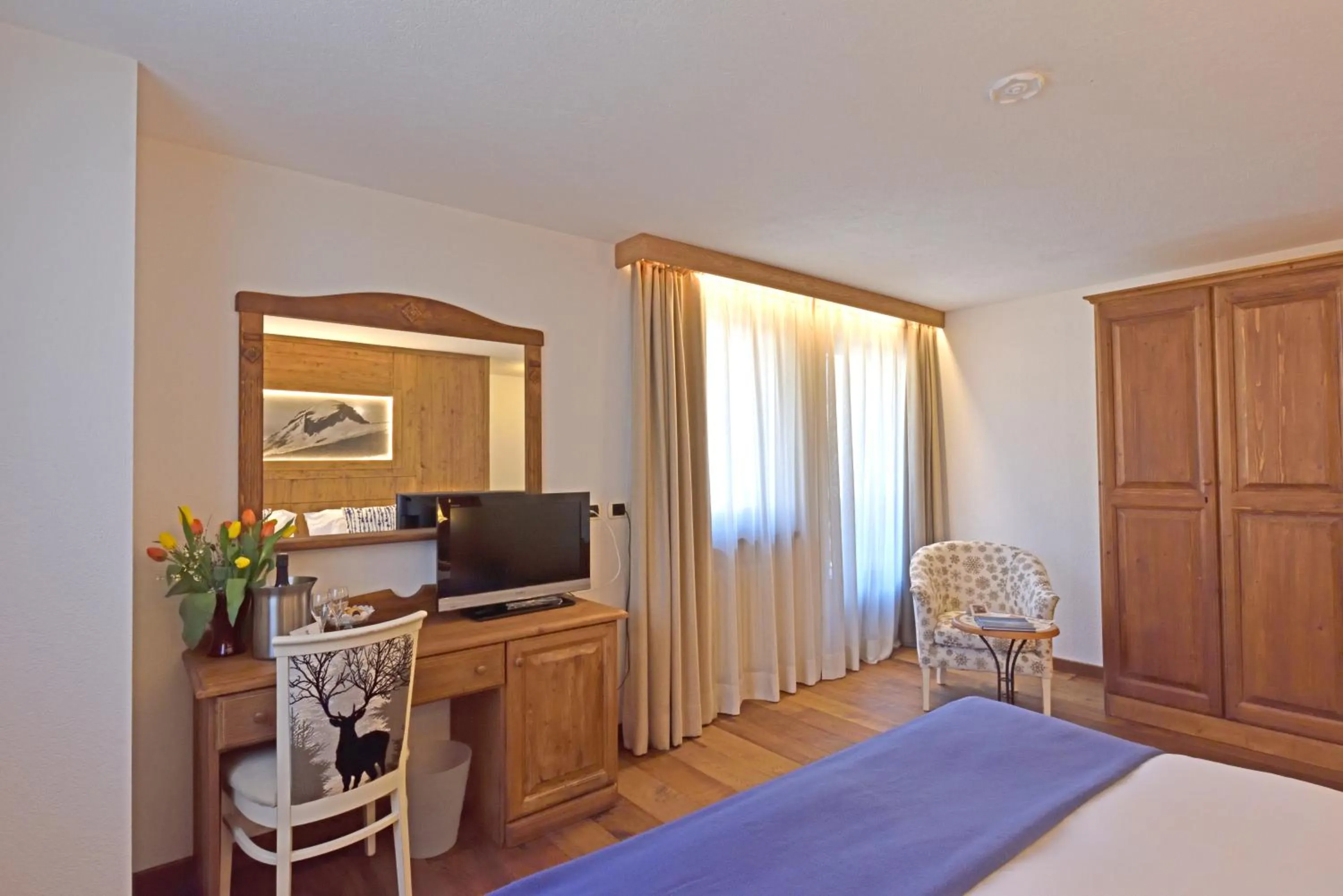 Bed in Hotel Beau Sejour