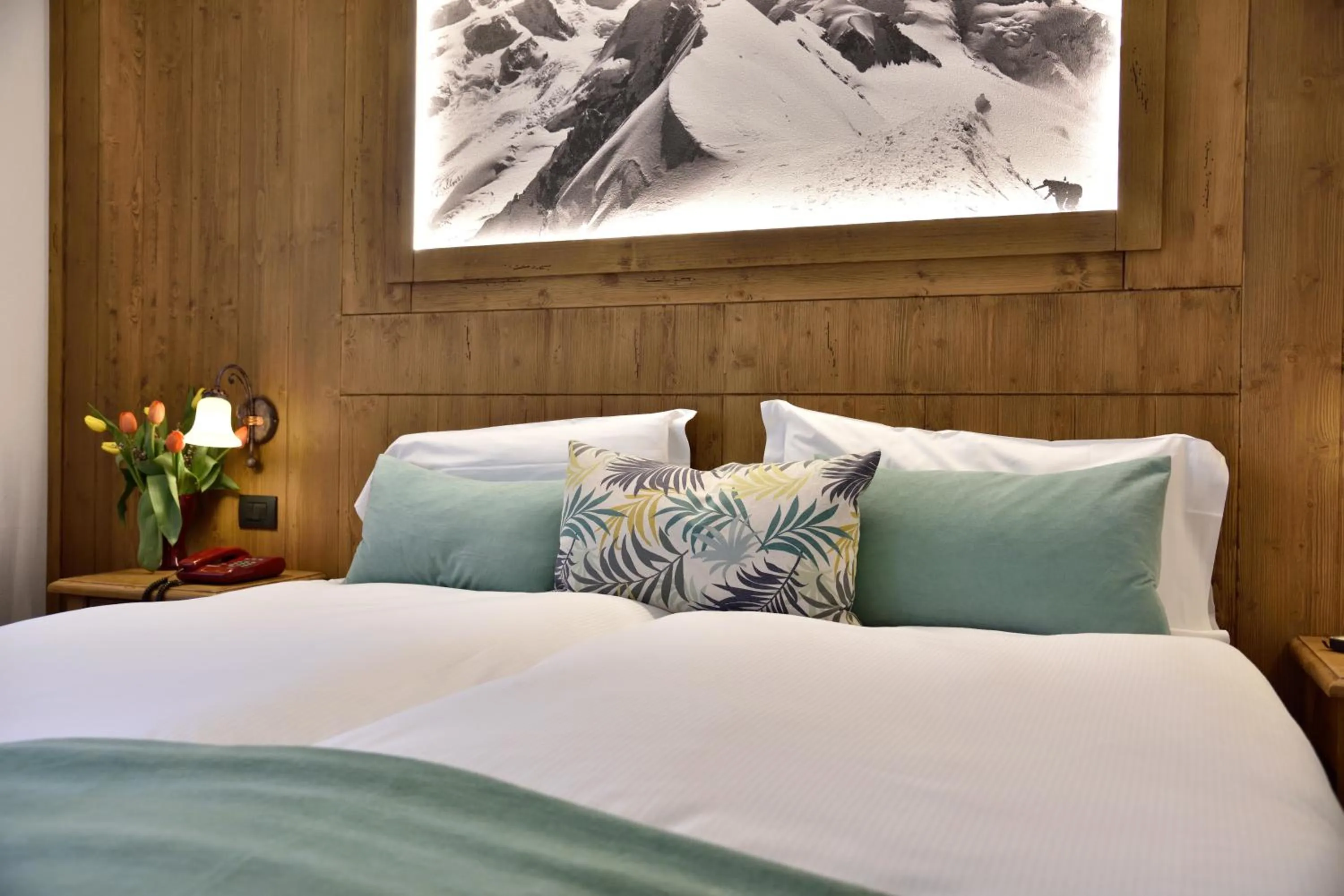 Bed in Hotel Beau Sejour