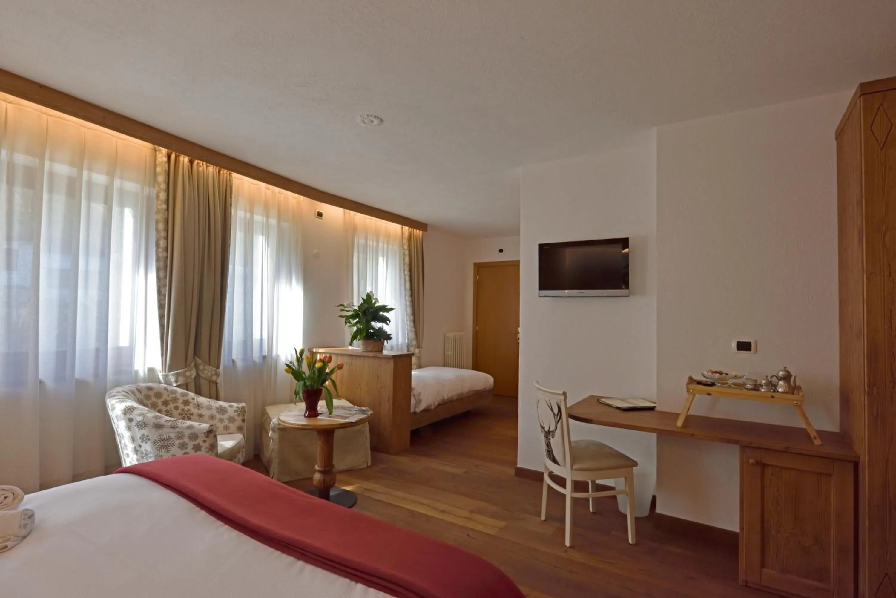 Bed in Hotel Beau Sejour