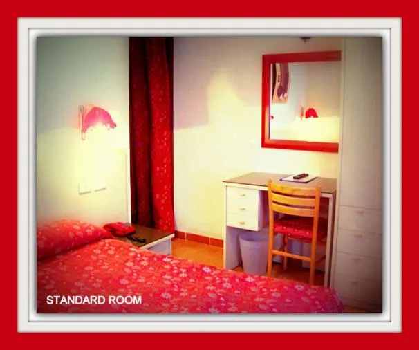 Bed in Hotel Beau Sejour