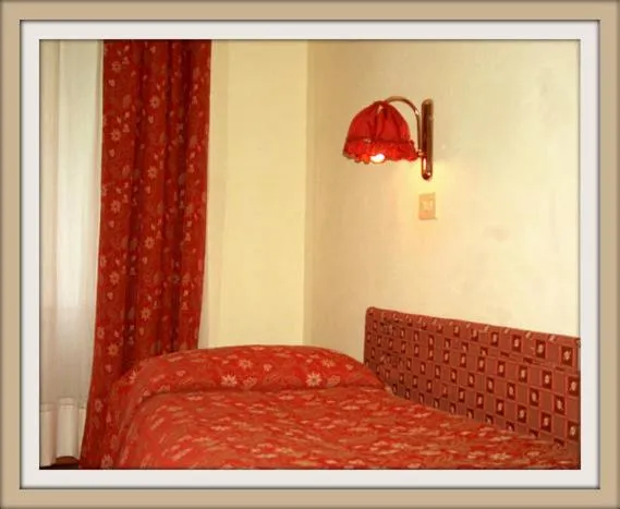 Bed in Hotel Beau Sejour