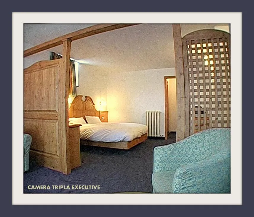 Bed in Hotel Beau Sejour