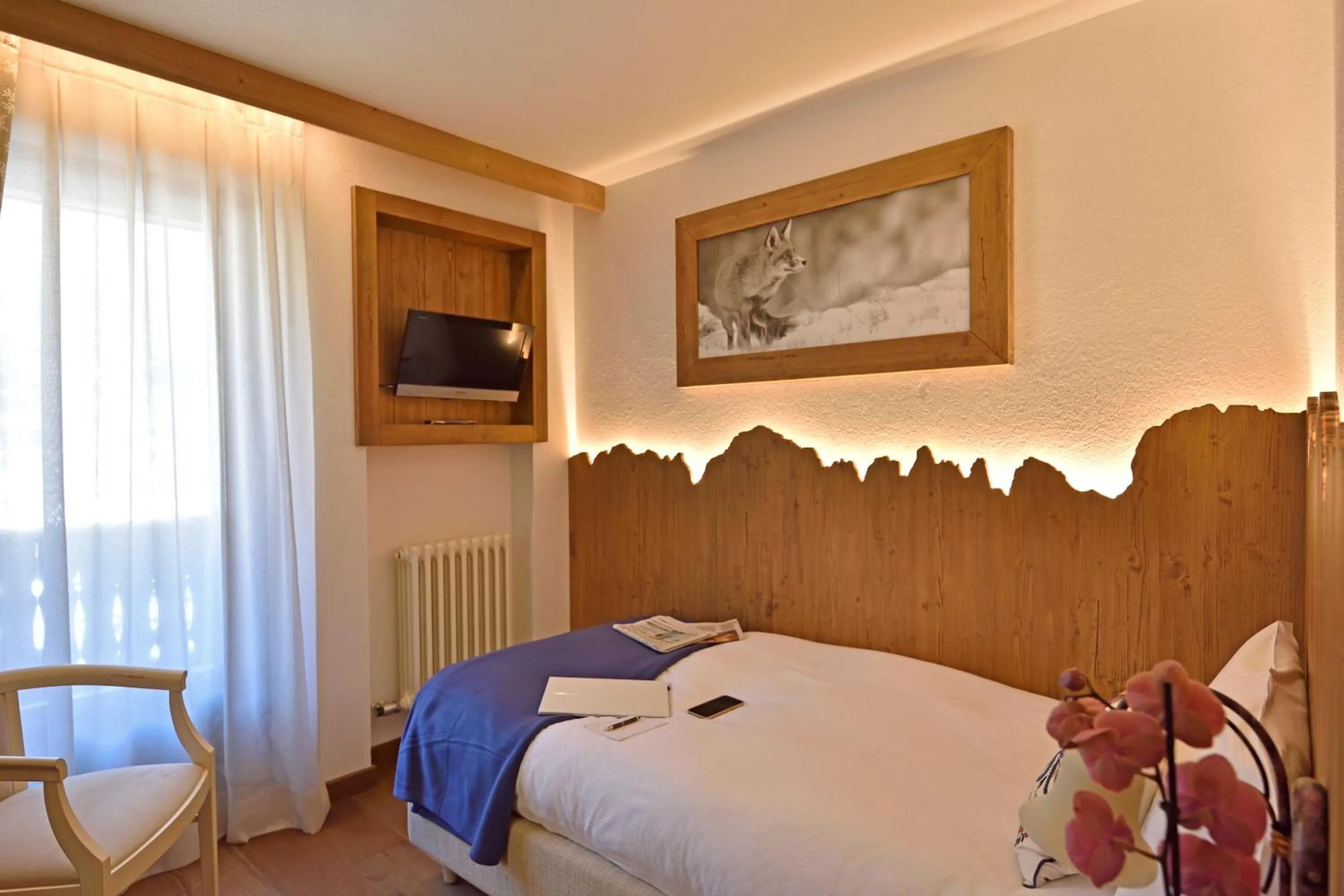 Bed in Hotel Beau Sejour