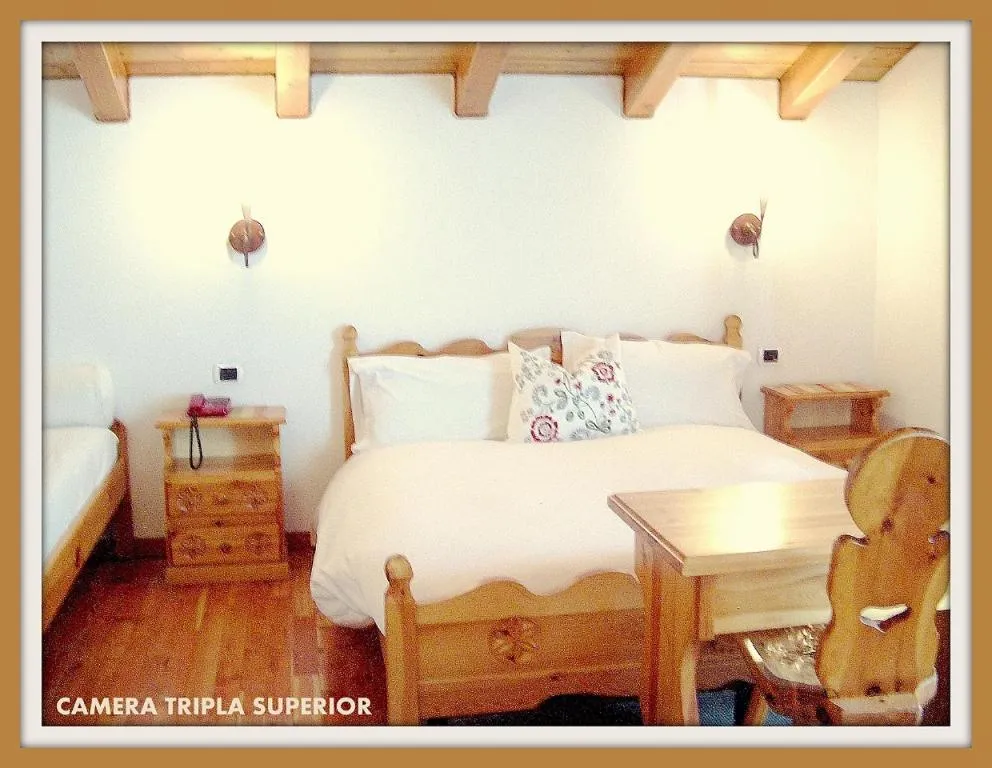 Bed in Hotel Beau Sejour