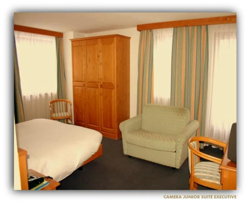 Bed in Hotel Beau Sejour