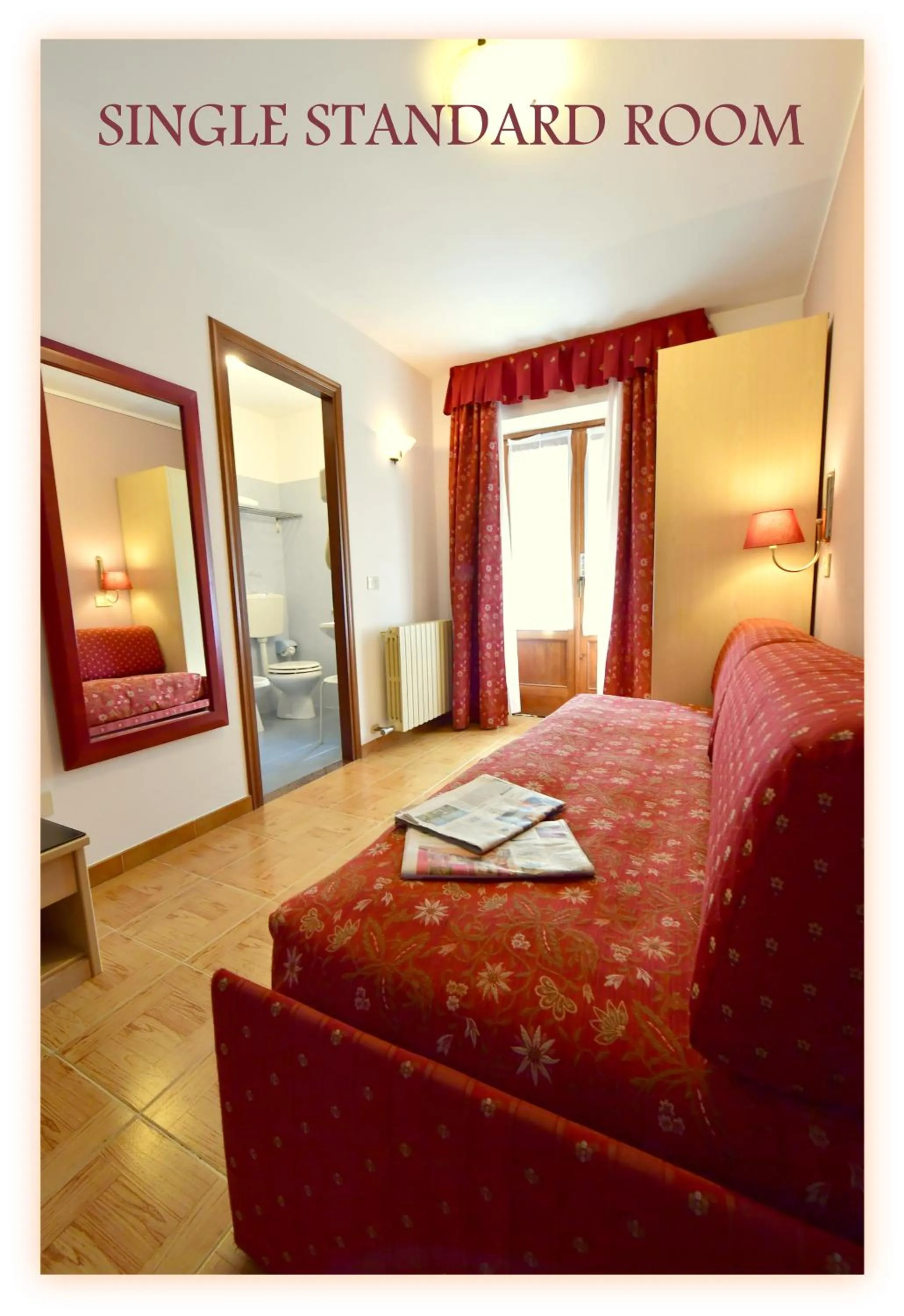 Bed in Hotel Beau Sejour