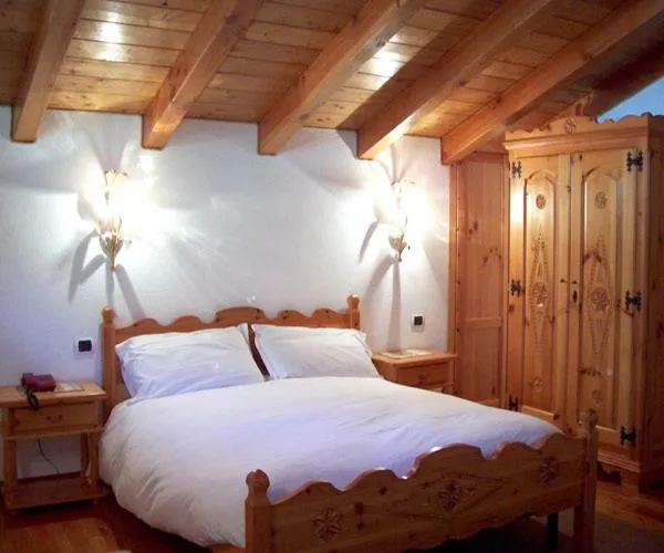 Bed in Hotel Beau Sejour