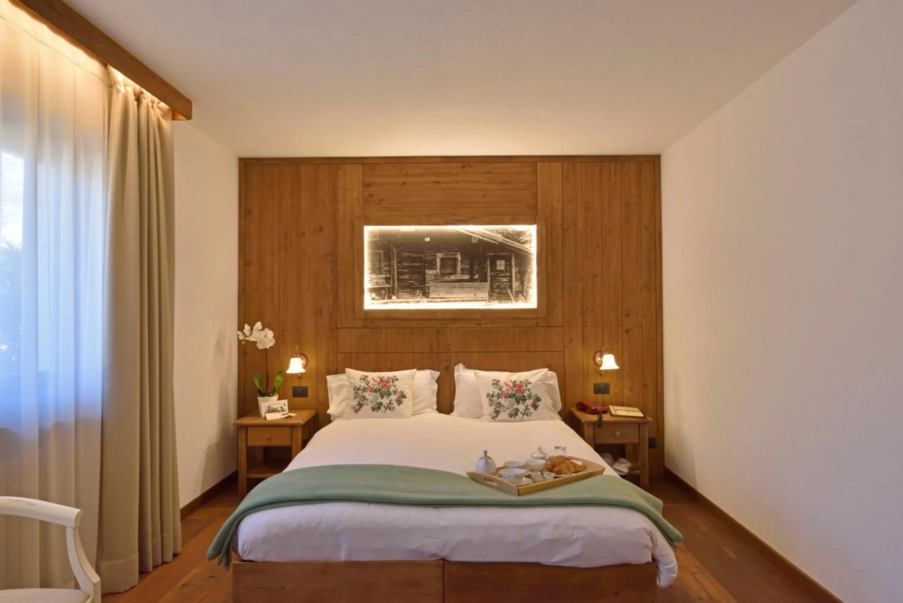 Bed in Hotel Beau Sejour