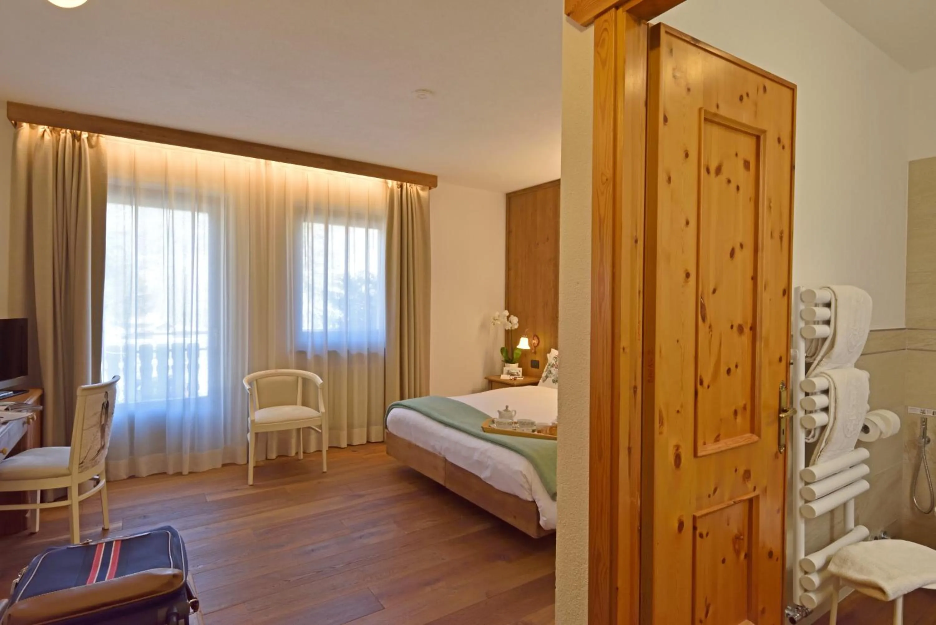 Bed in Hotel Beau Sejour