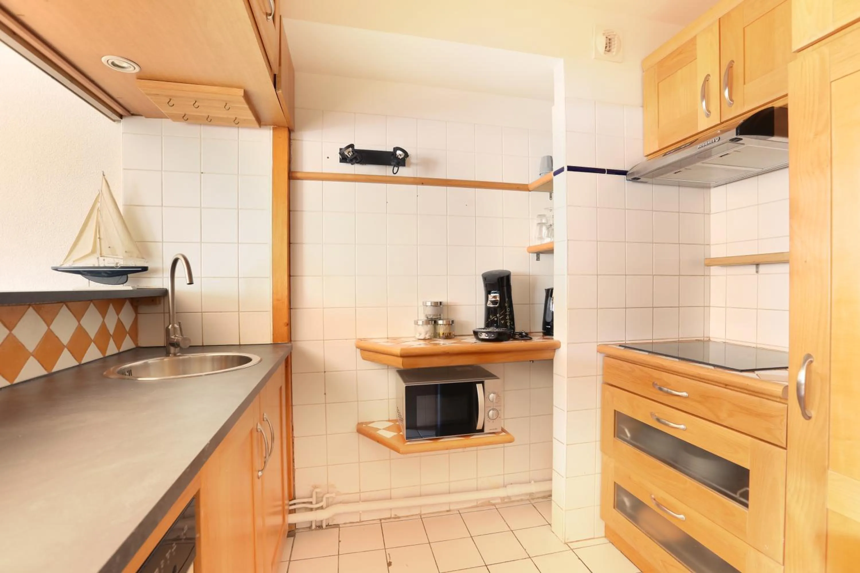 Kitchen or kitchenette in Les Lilas Serviced Apartments