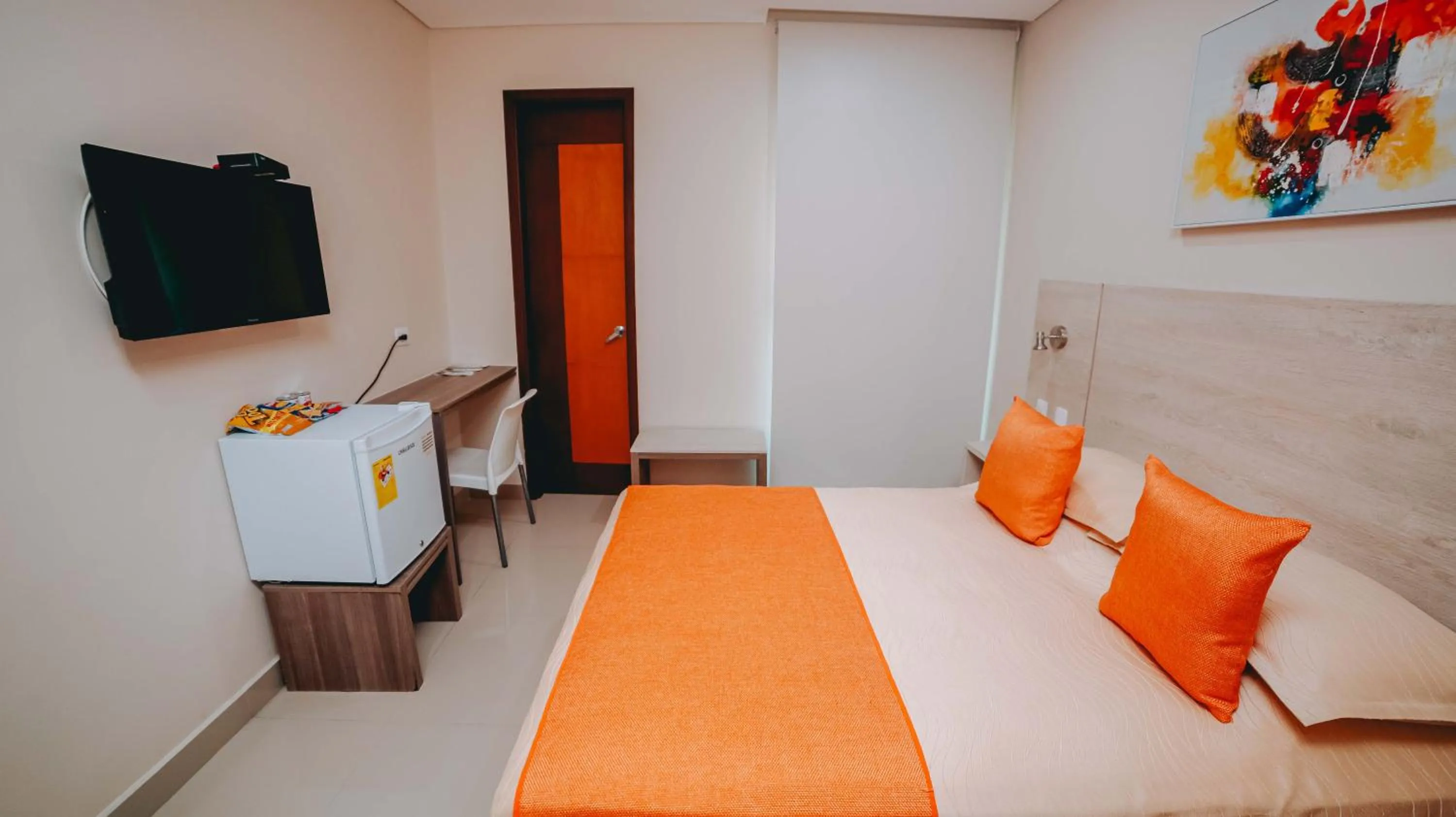 Communal lounge/ TV room, Bed in Hotel Seven Monteria