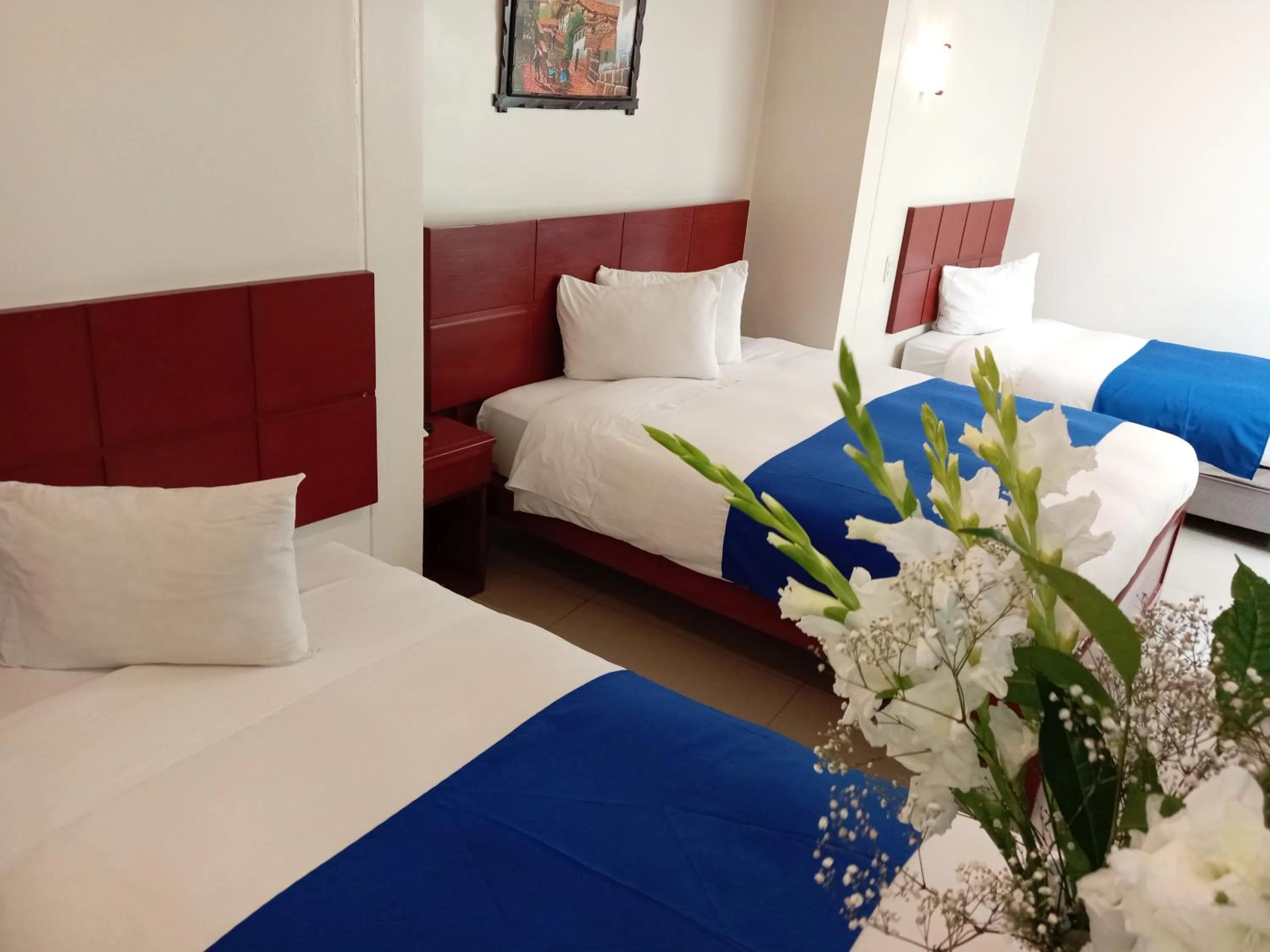 Bed in Aqua Hotel Cusco