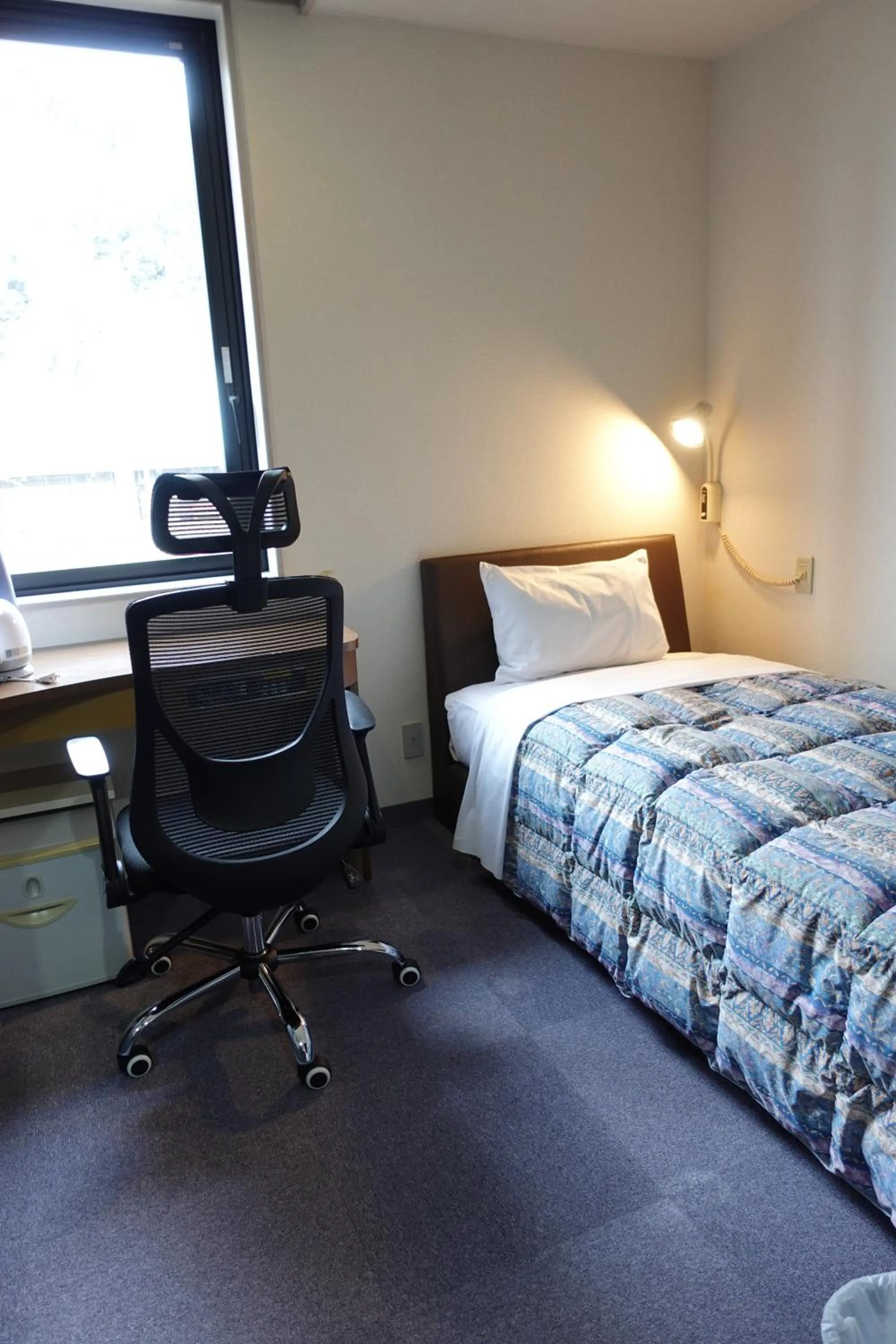Photo of the whole room, Bed in Station Business Hotel Tenshukaku