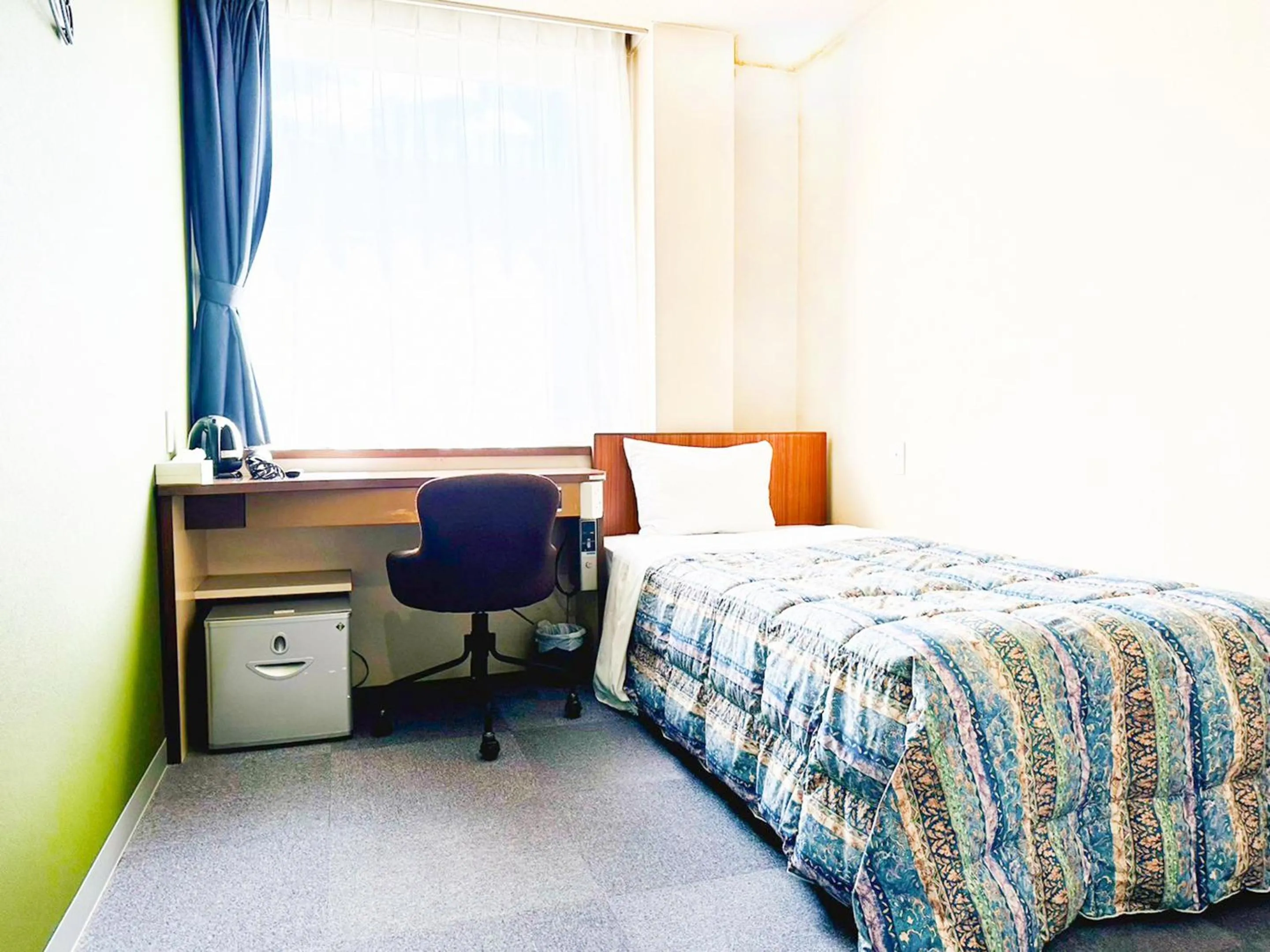 Photo of the whole room, Bed in Station Business Hotel Tenshukaku