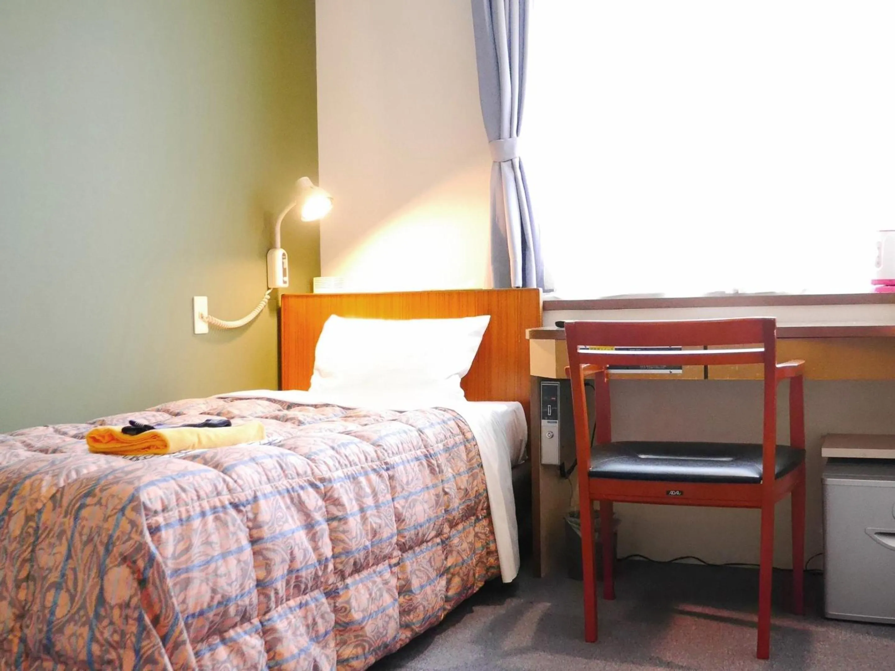 Bed in Station Business Hotel Tenshukaku