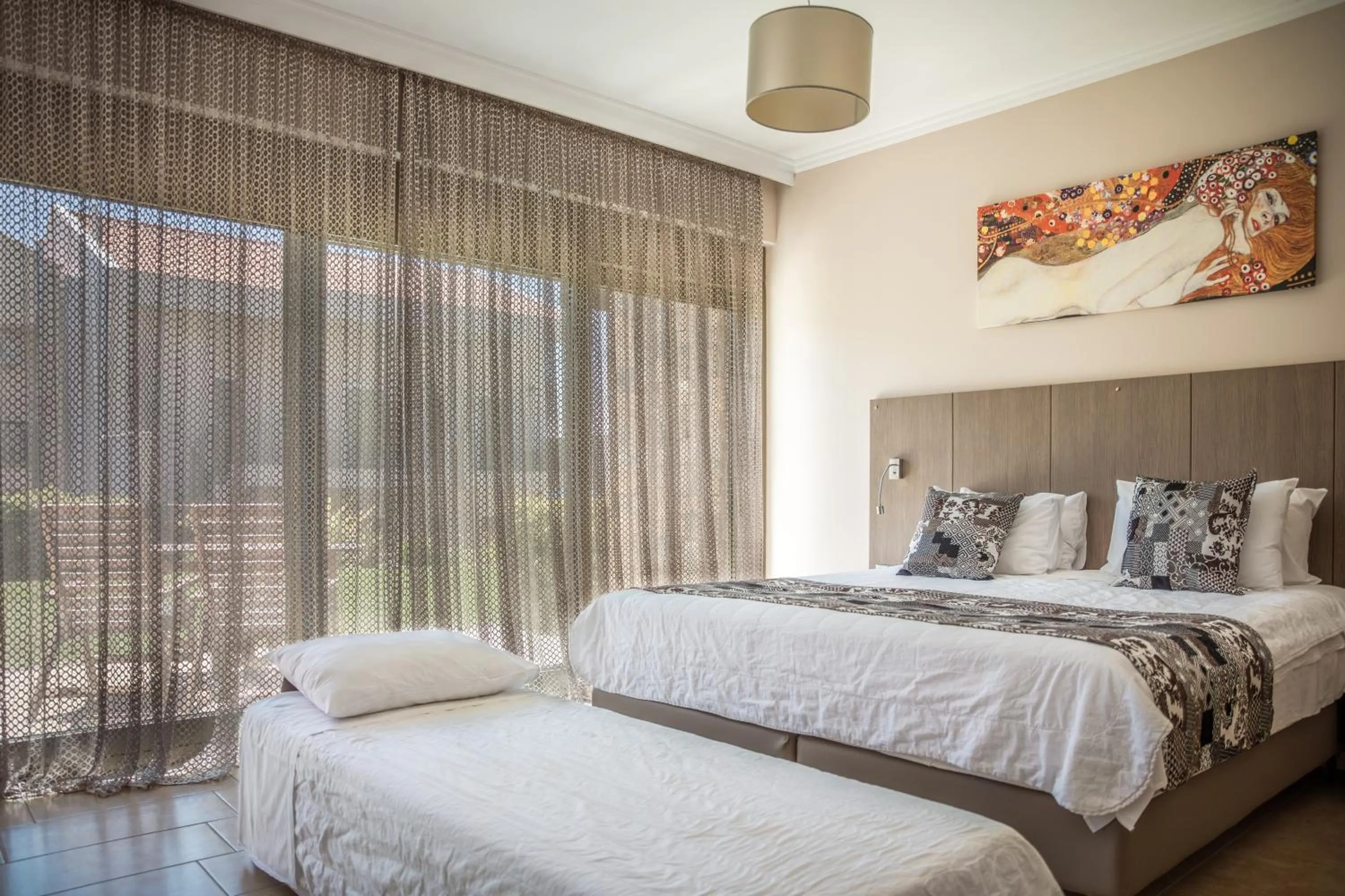 Bed in Royalty Suites Seaside