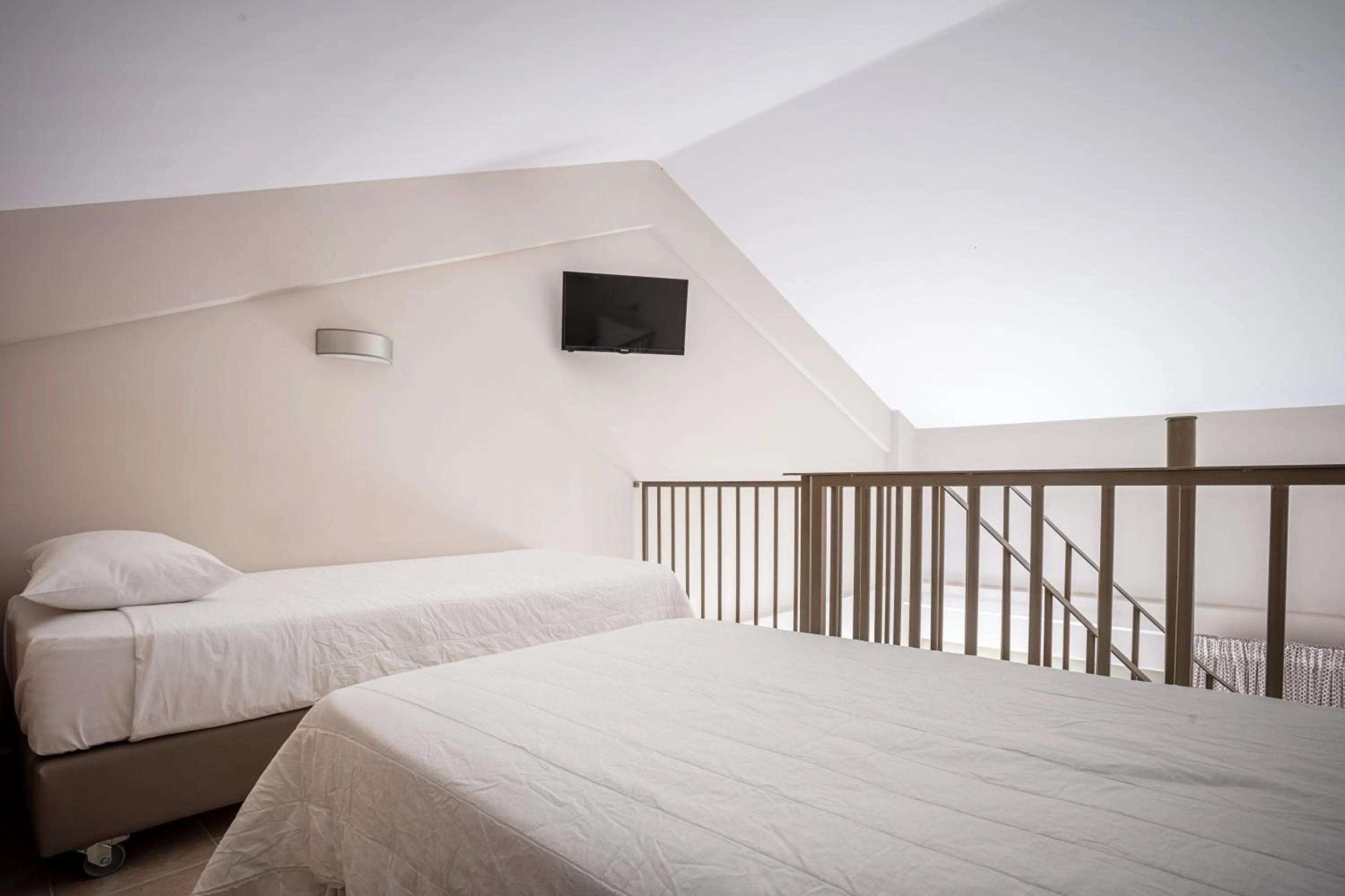 Bed in Royalty Suites Seaside