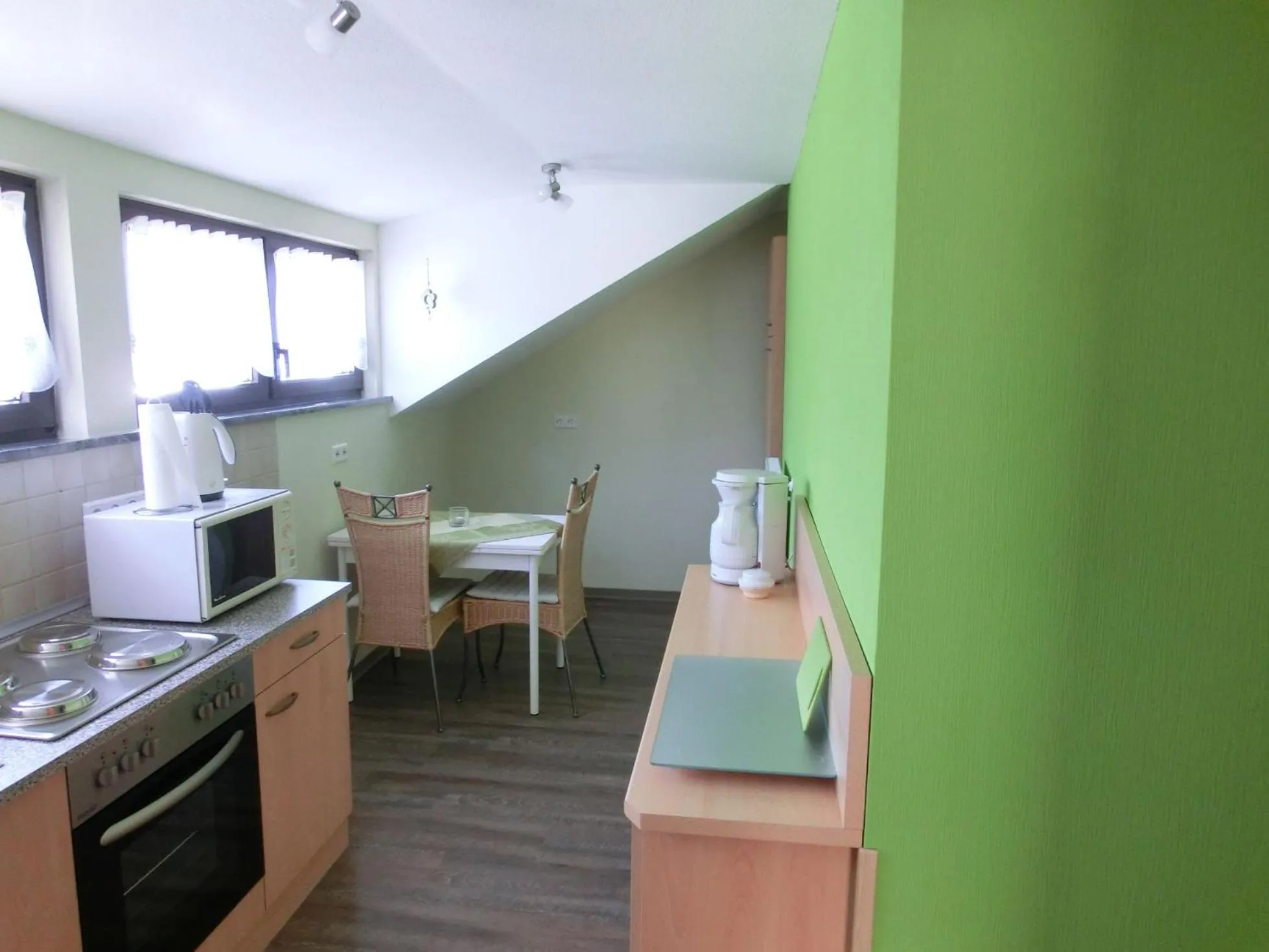 Kitchen or kitchenette in Ferienwohnung Rivaner