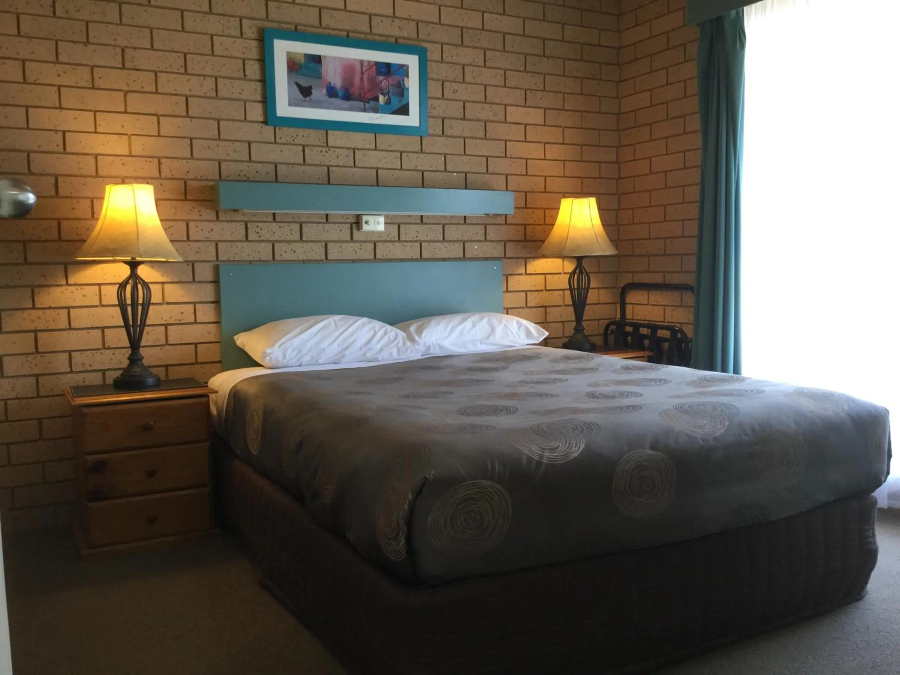 Bed in Sunrise Motel