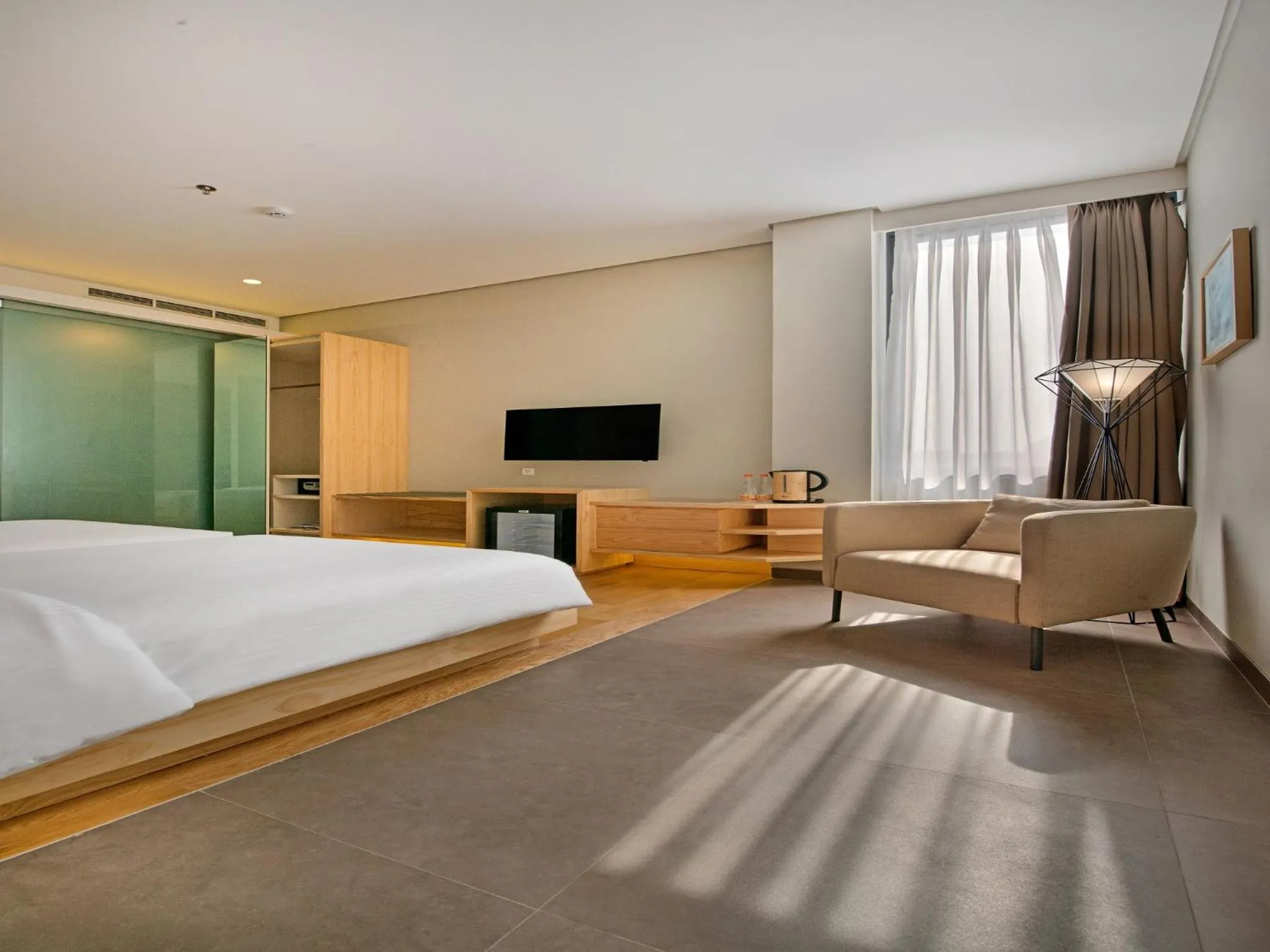 Living room, Bed in Tama Boutique Hotel