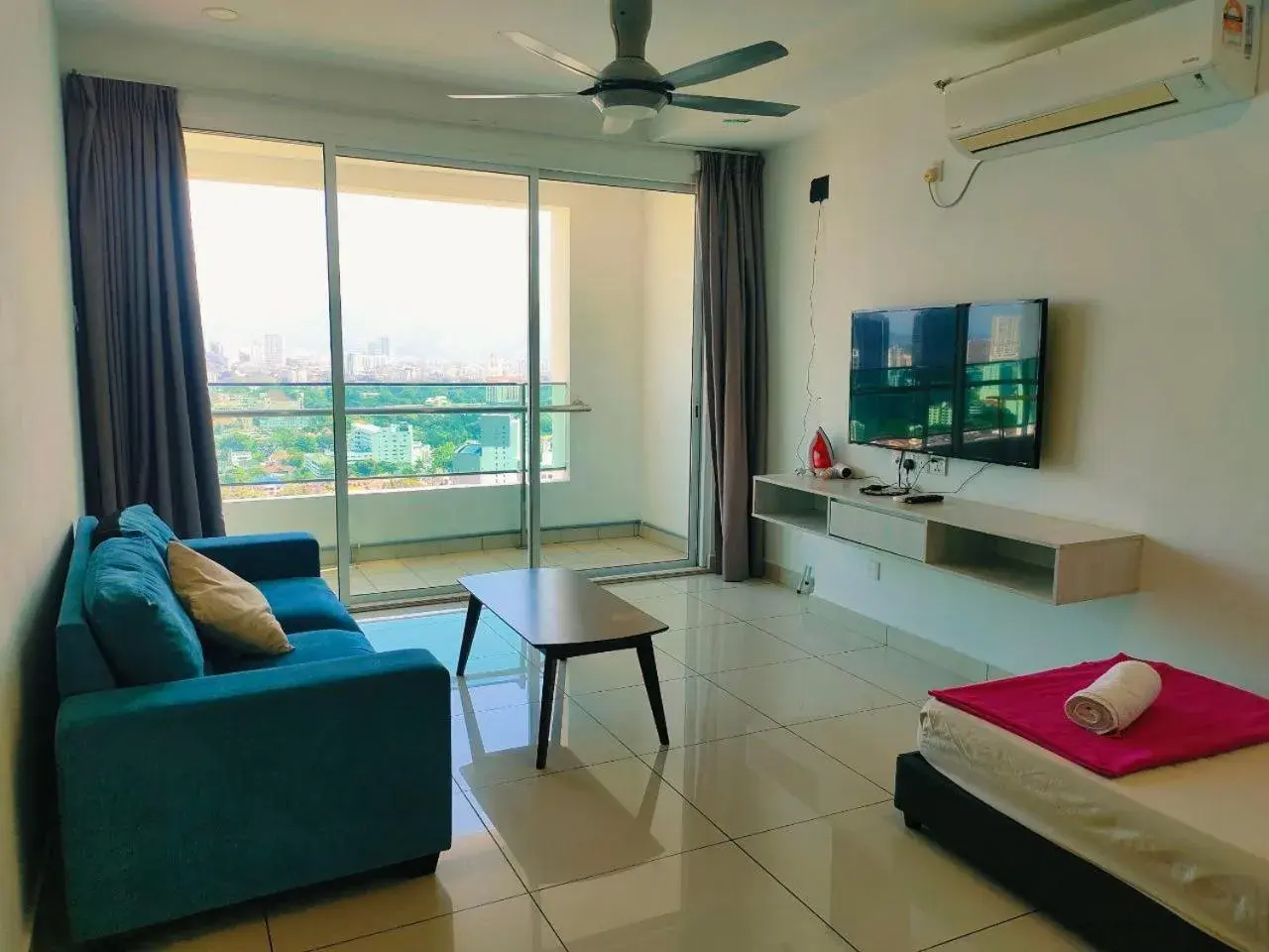 Living room in Merlene Suites at Mansion One Formerly know as Mansion One Suites Living room in Merlene Suites at Mansion One Formerly know as Mansion One Suites