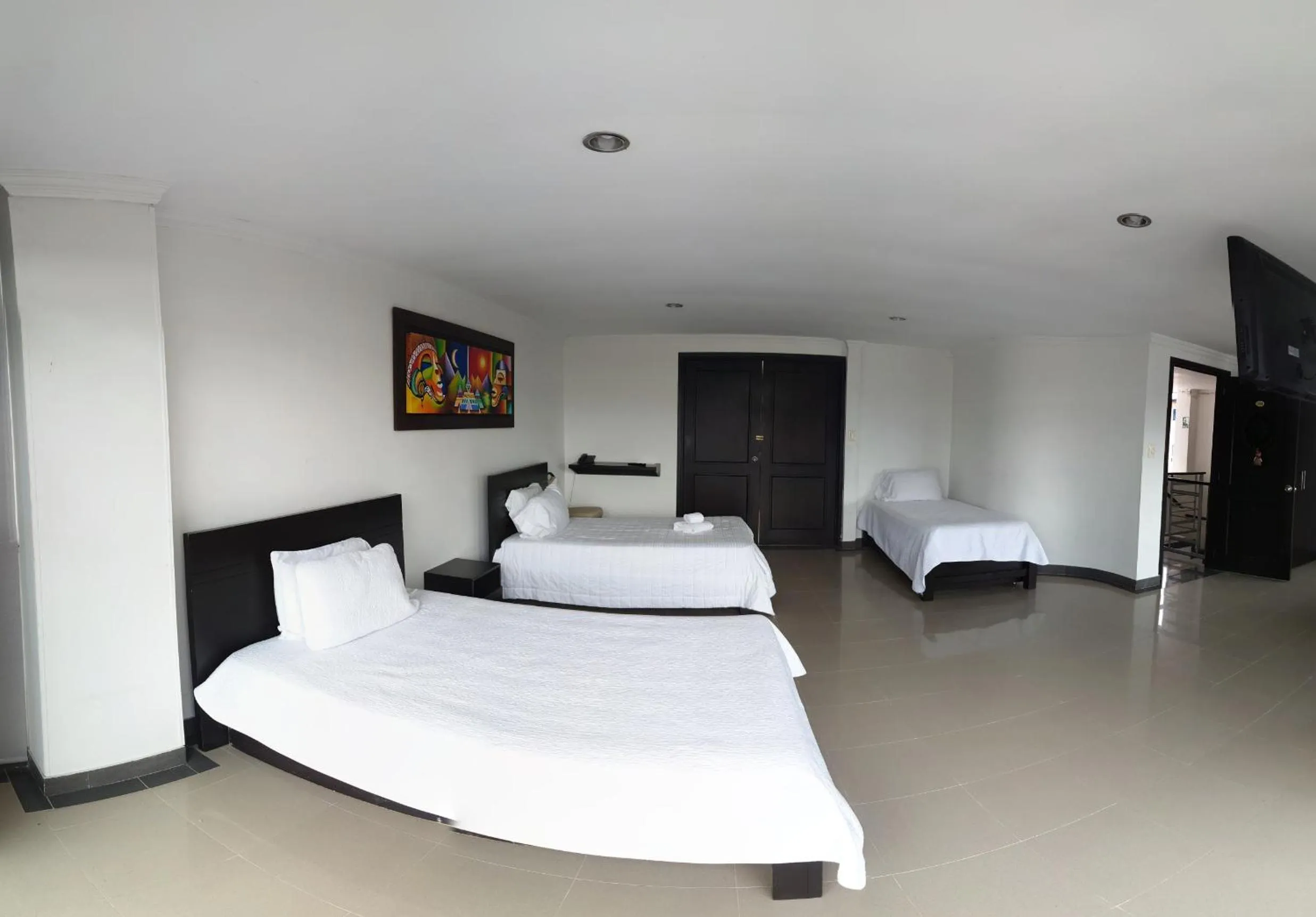 Communal lounge/ TV room, Bed in Hotel Andinos Plaza Pitalito