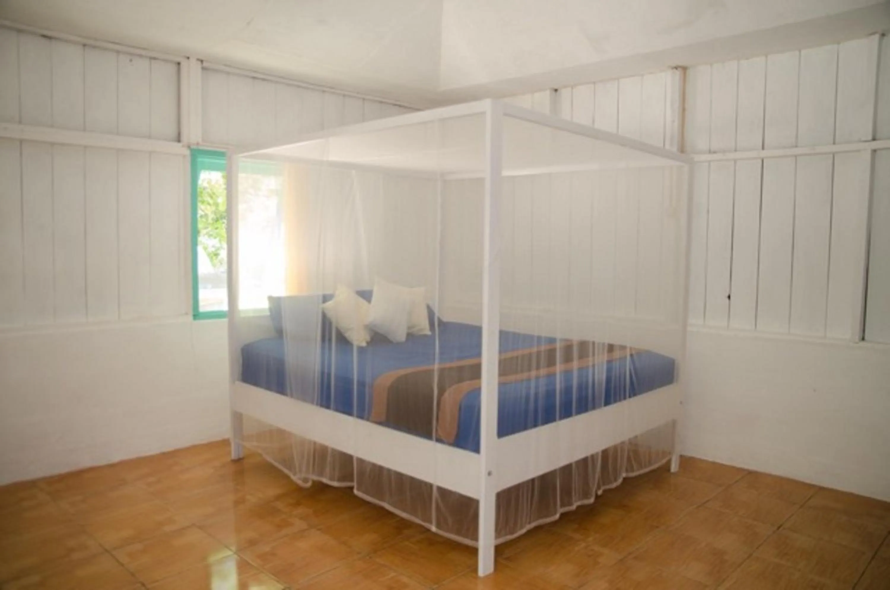 Bed in Scuba Republic Beach Bungalows