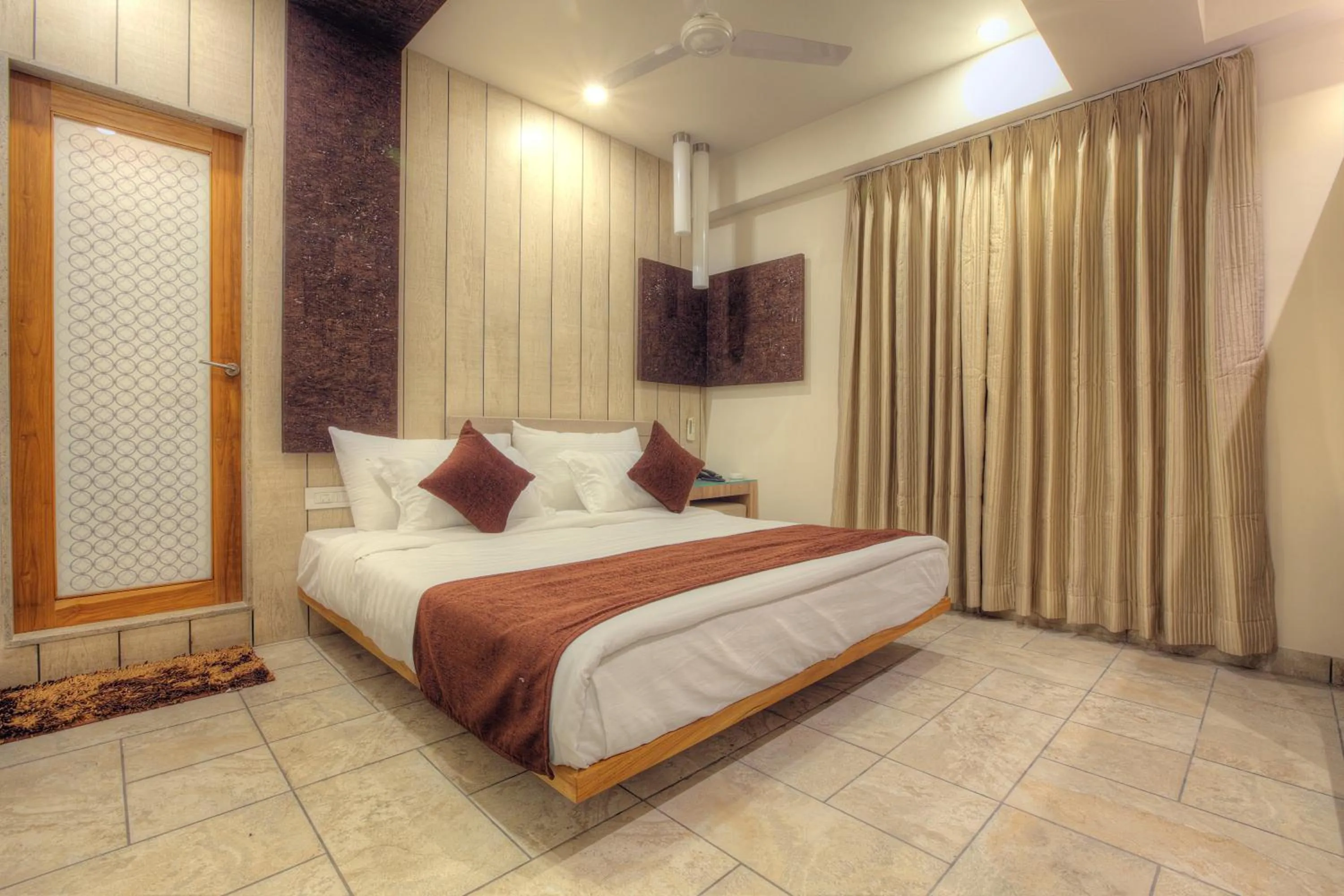 Photo of the whole room, Bed in Scenaria Hotel - Navrangpura, Ahmedabad