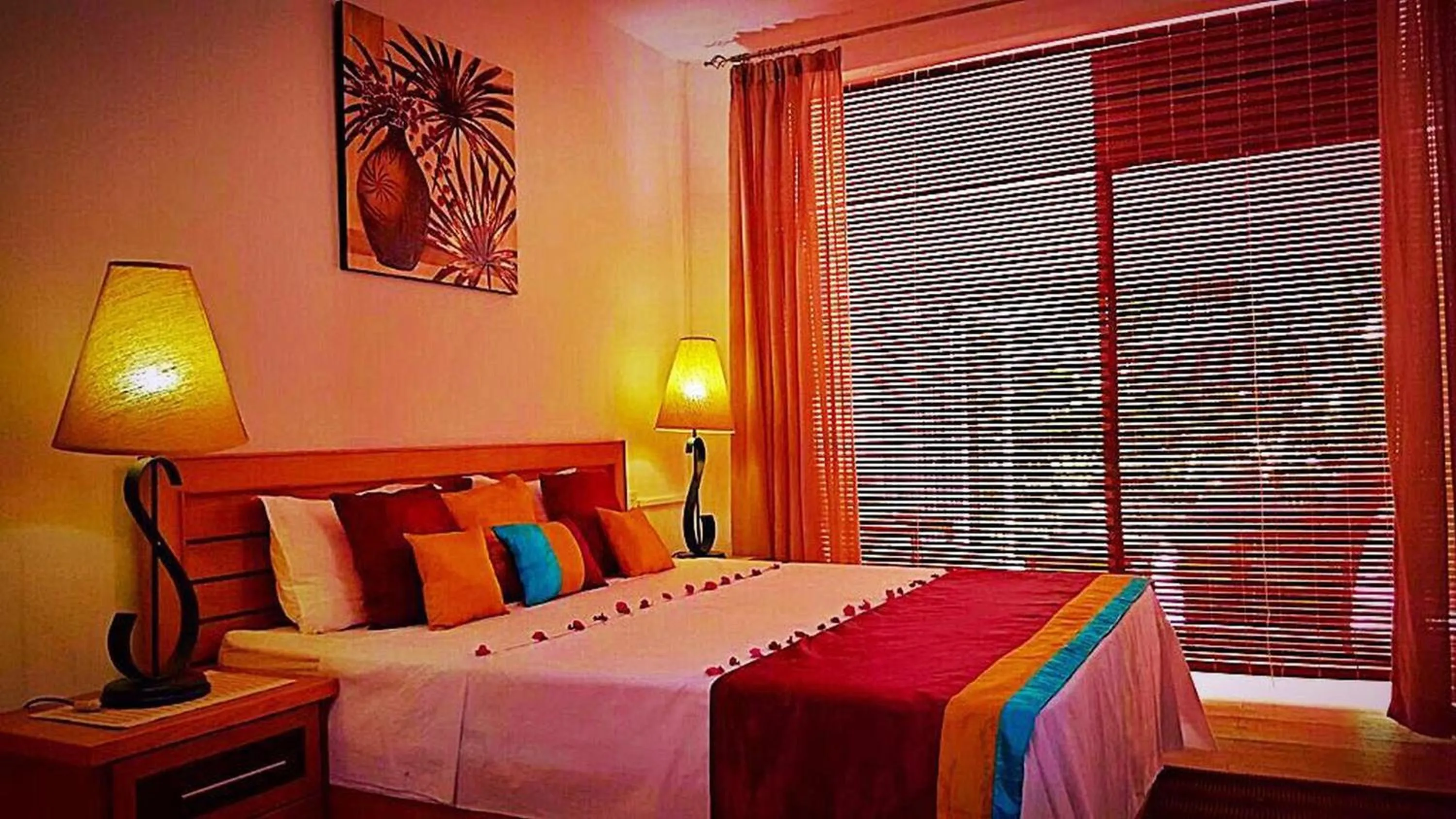 Bed in Ocean Villas Apart Hotel