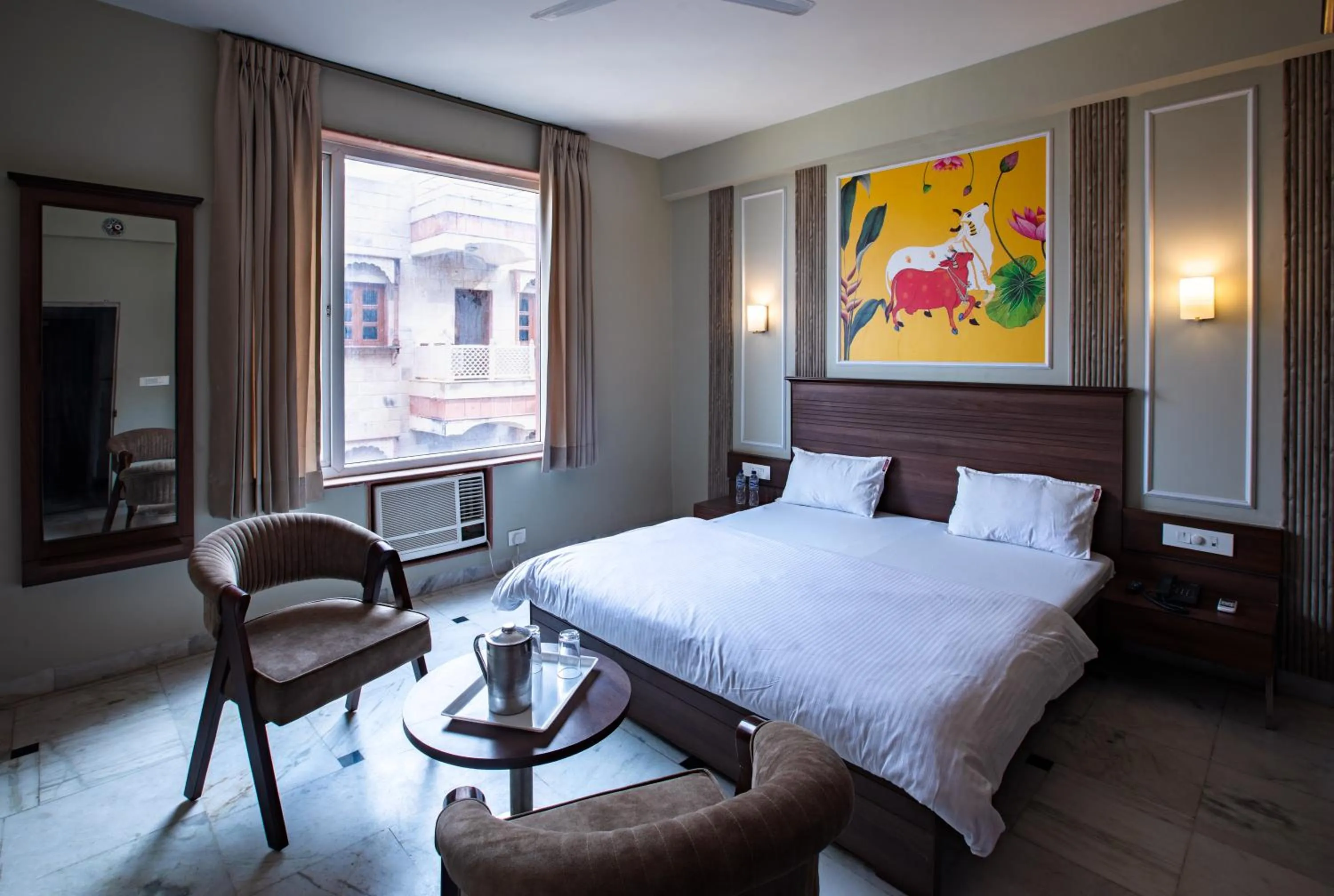 Bed in Hotel Bhakti Dhama