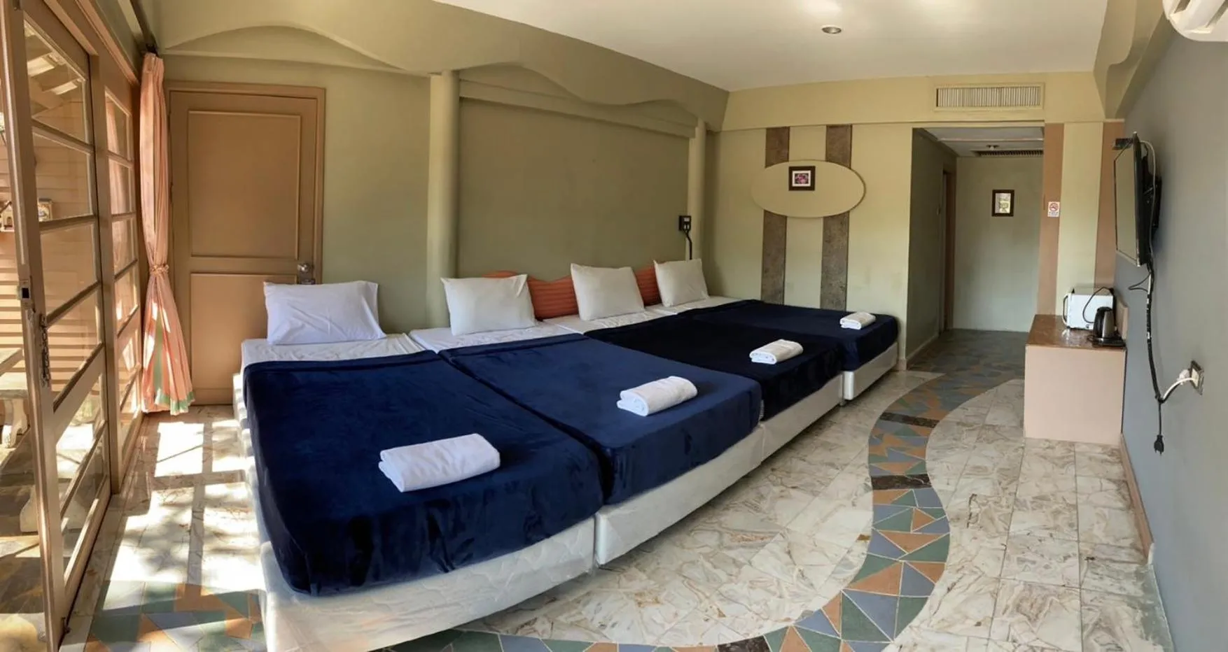Bed in Rockgarden Beach Resort