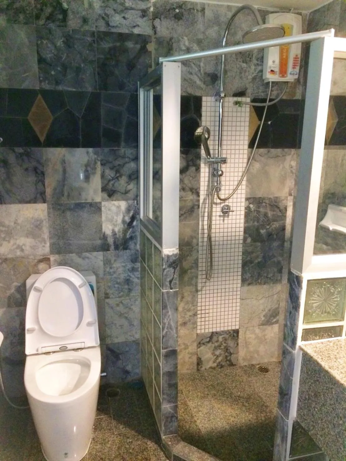 Toilet in Rockgarden Beach Resort