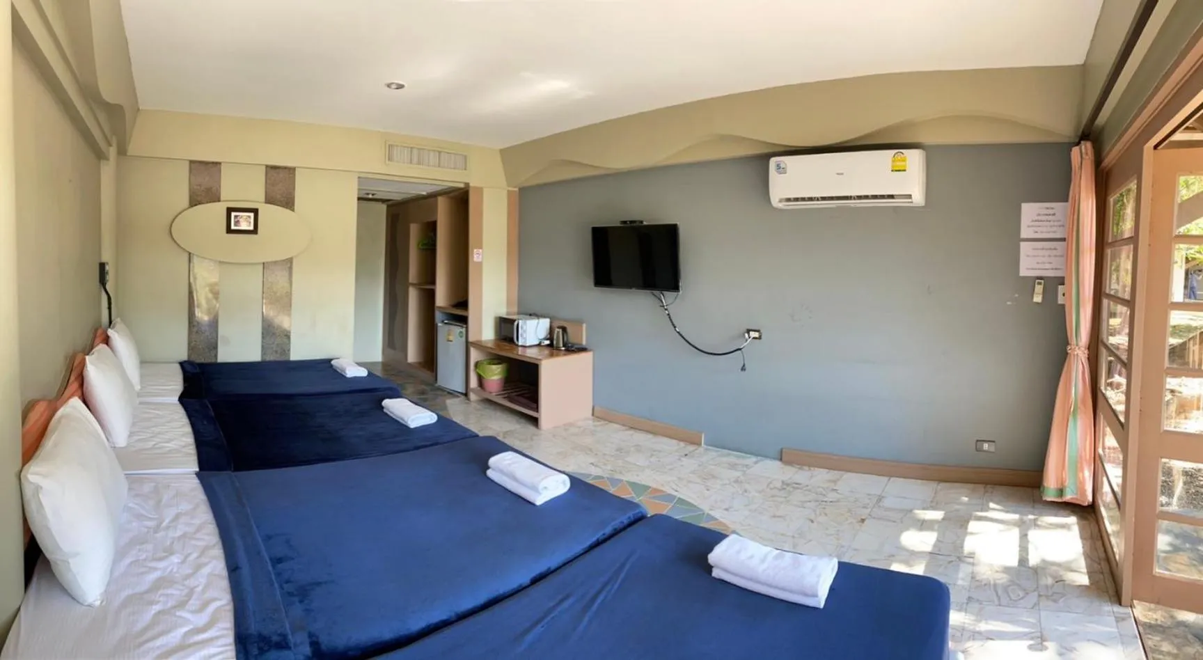Photo of the whole room, Bed in Rockgarden Beach Resort