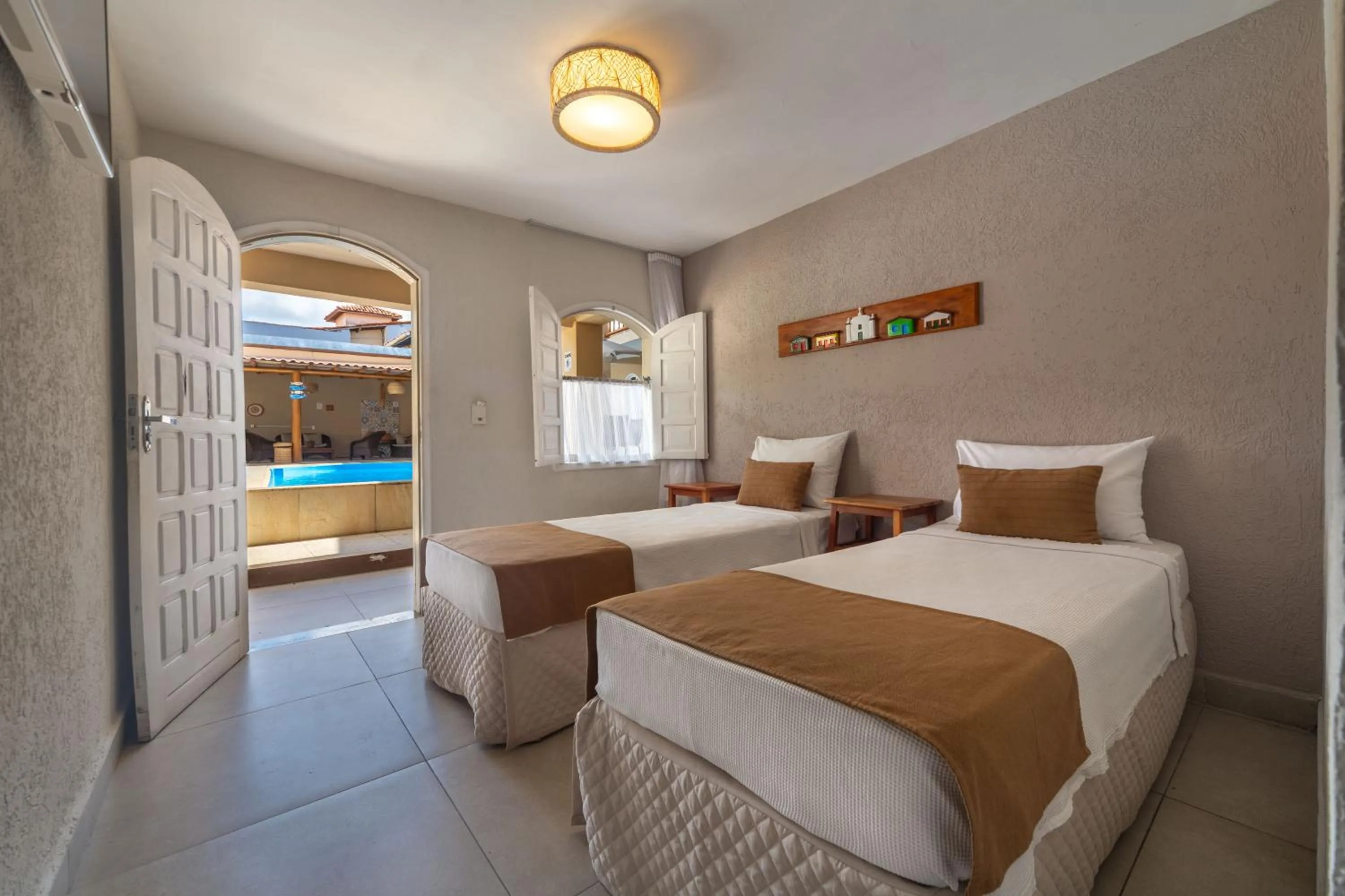 Bed in Pousada Jangadeiro