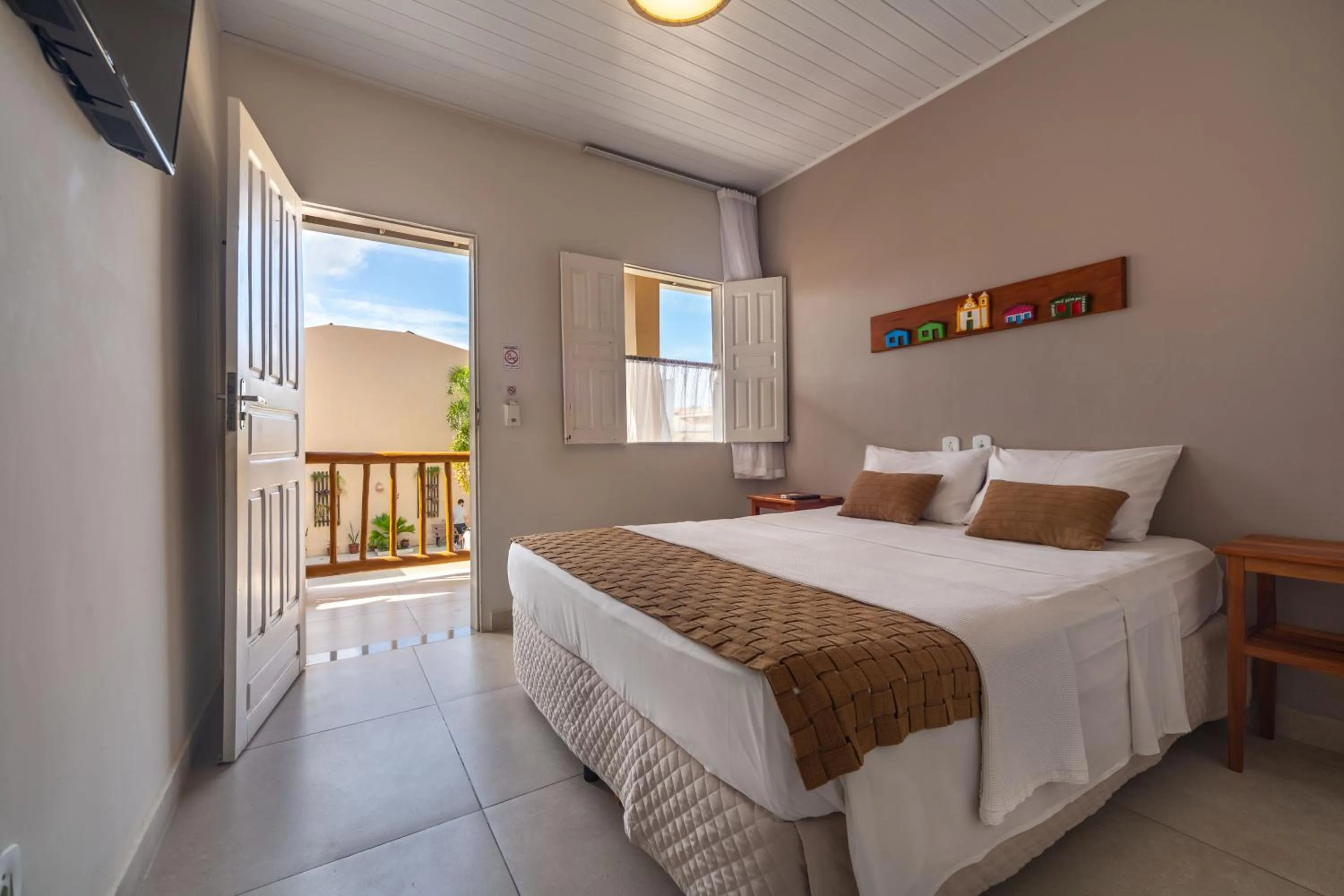 Bed in Pousada Jangadeiro