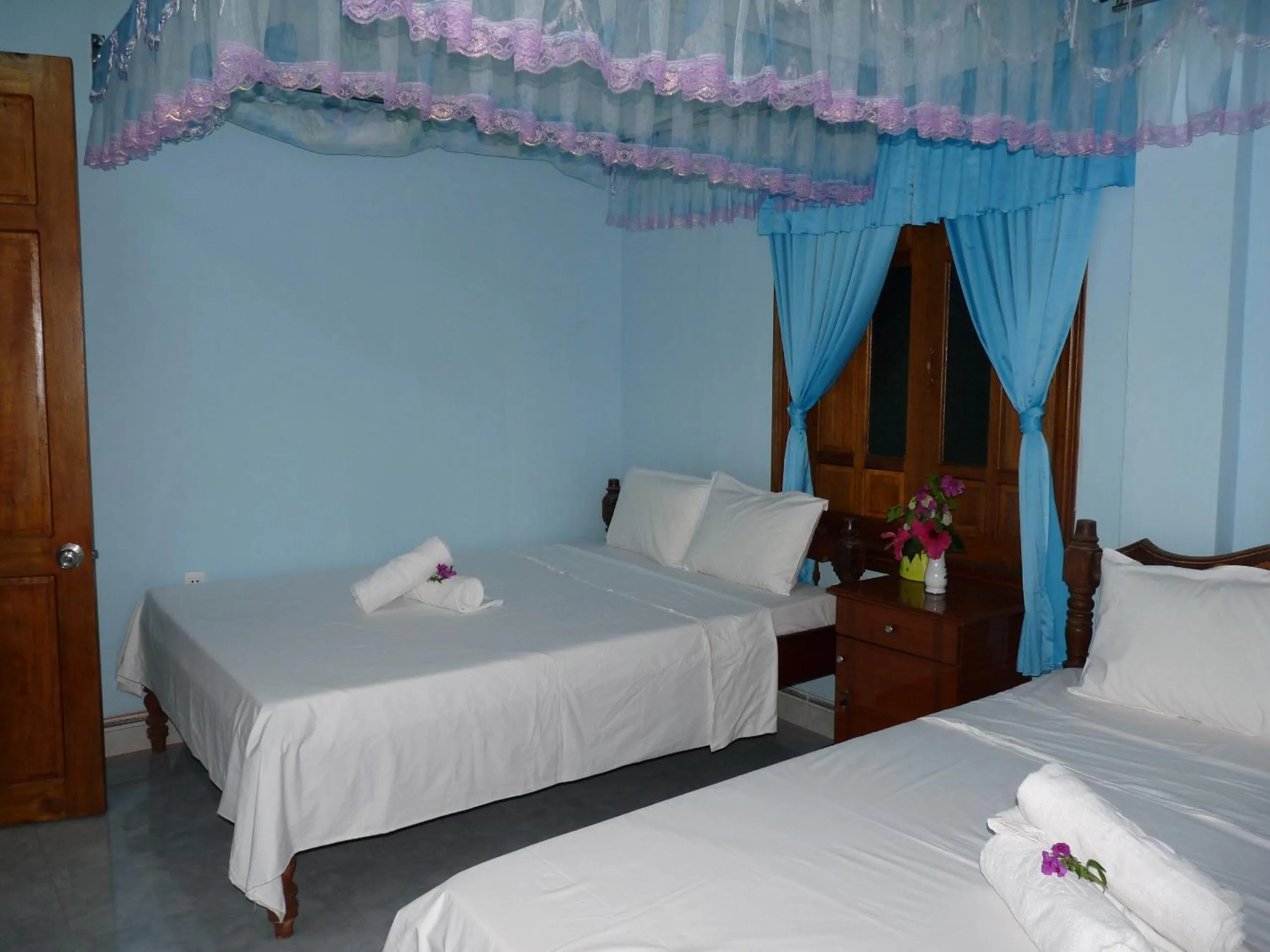 Bed in Cham Island Smiles Homestay