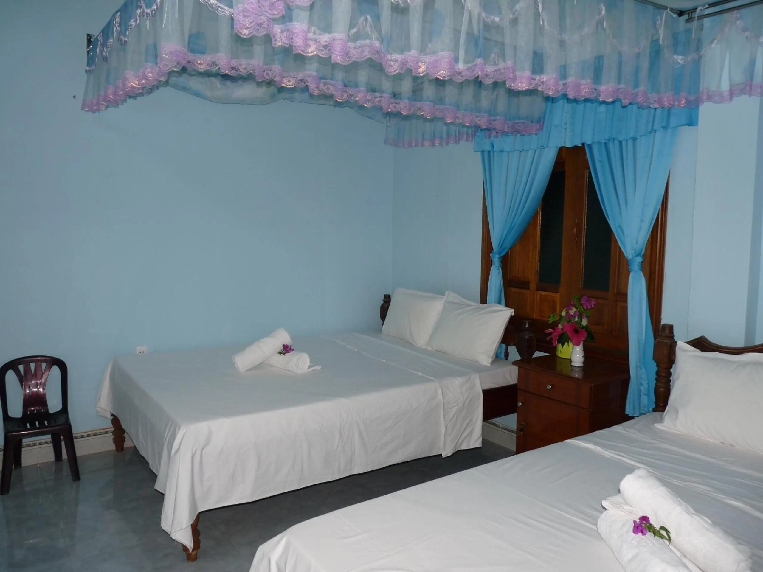 Bed in Cham Island Smiles Homestay
