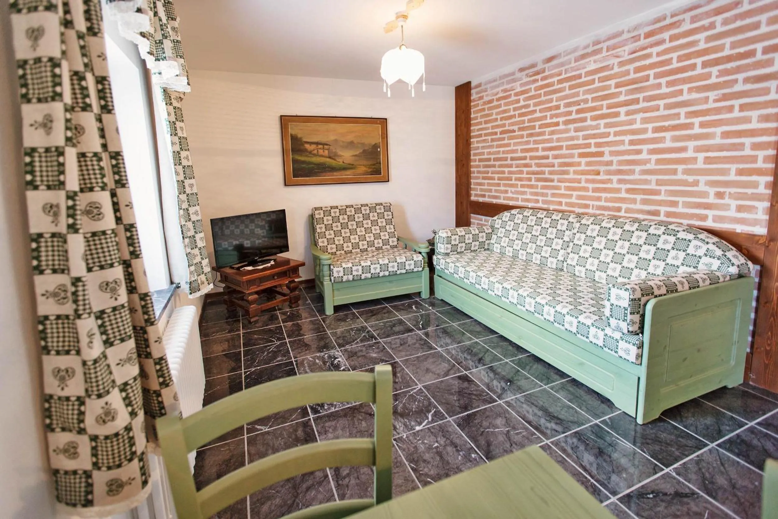 Living room, Bed in Albergo Diffuso "Col Gentile" Socchieve