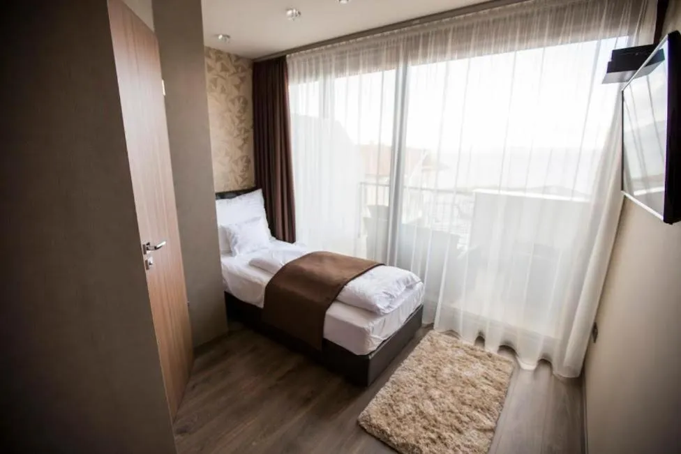 Bed in Pole Position Beach Hotel