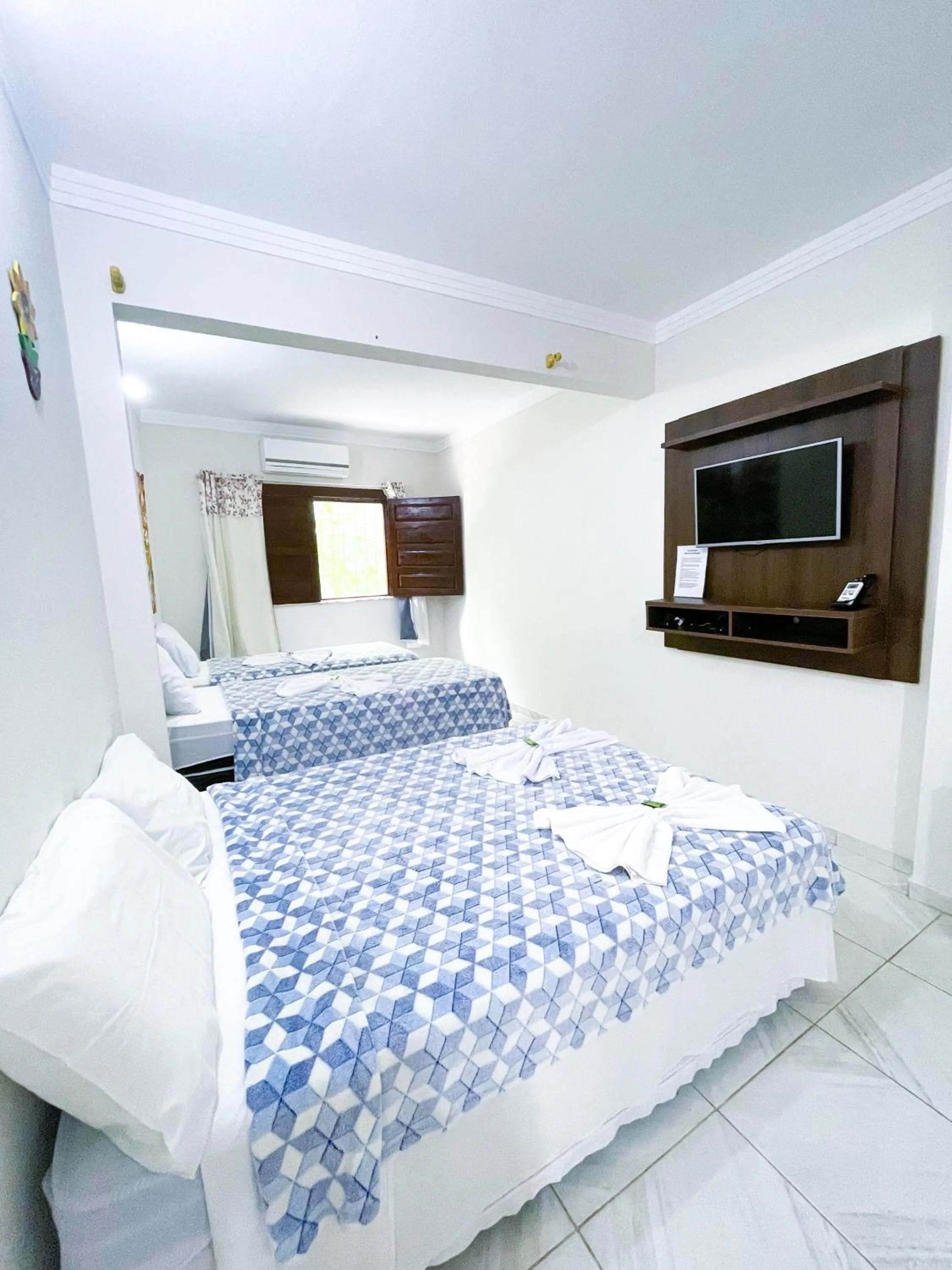 Bed in Pousada Vôo da Águia