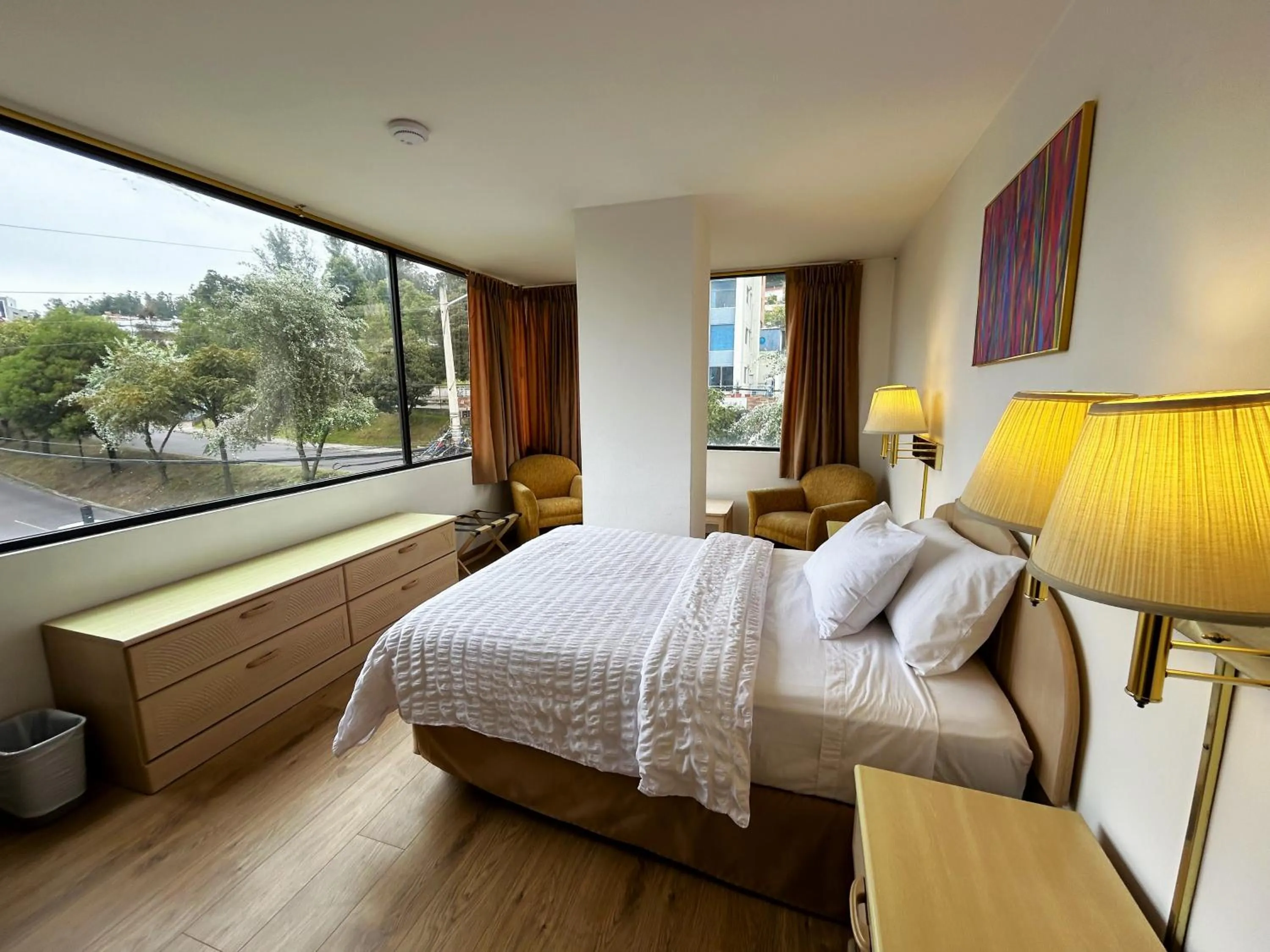 Bed in Stanford Suites Hotel