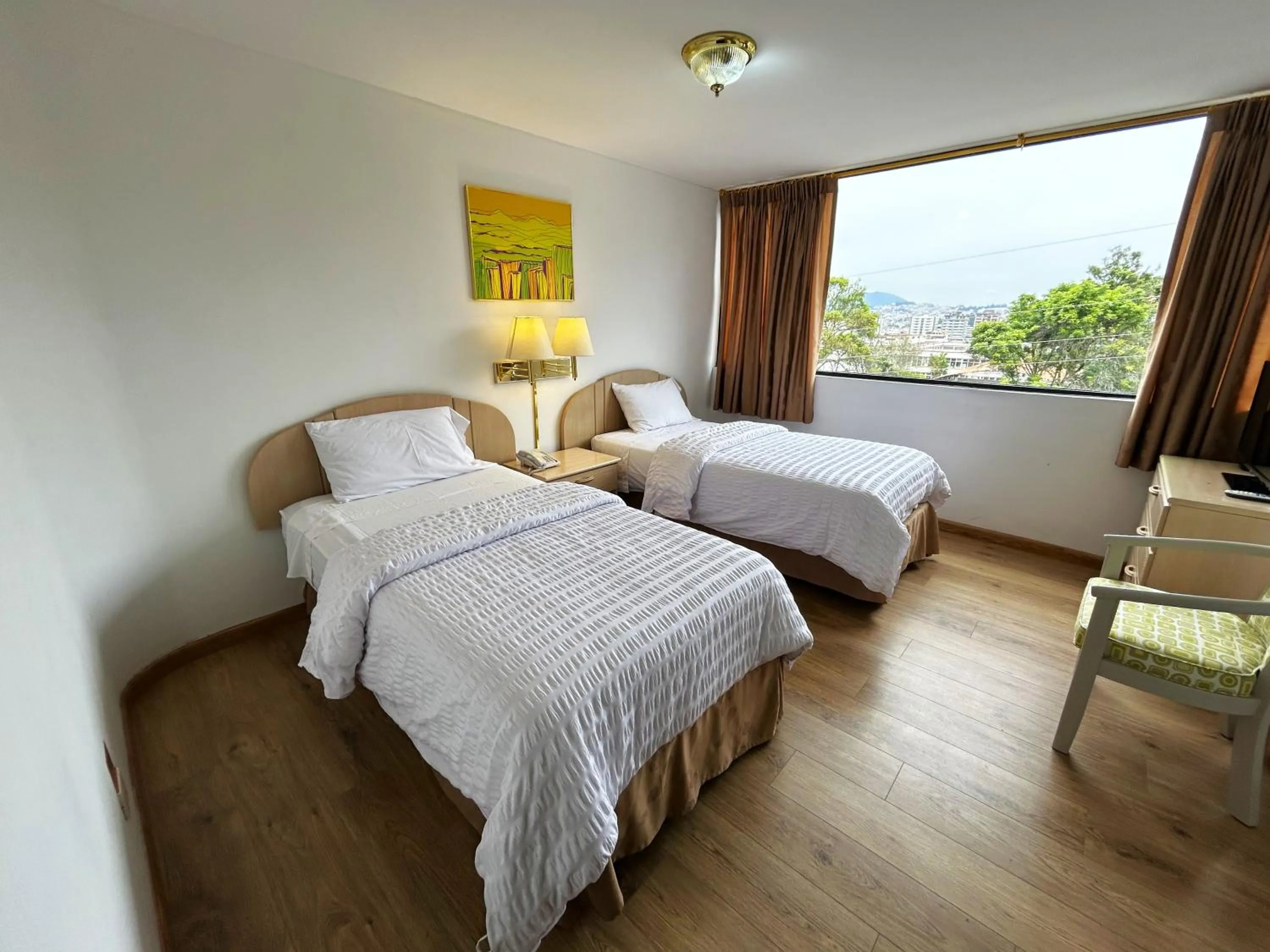 Bed in Stanford Suites Hotel