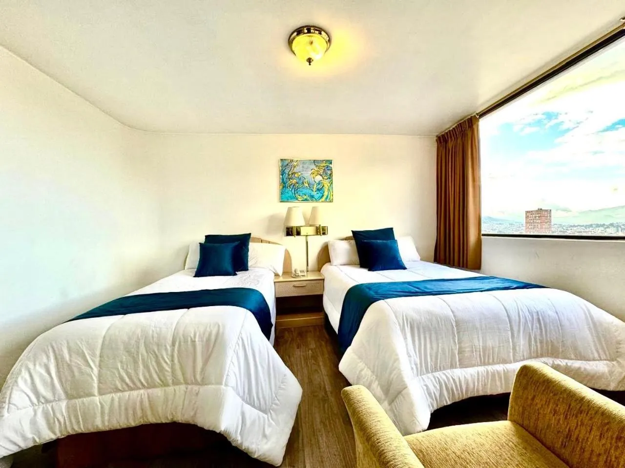 Bed in Stanford Suites Hotel