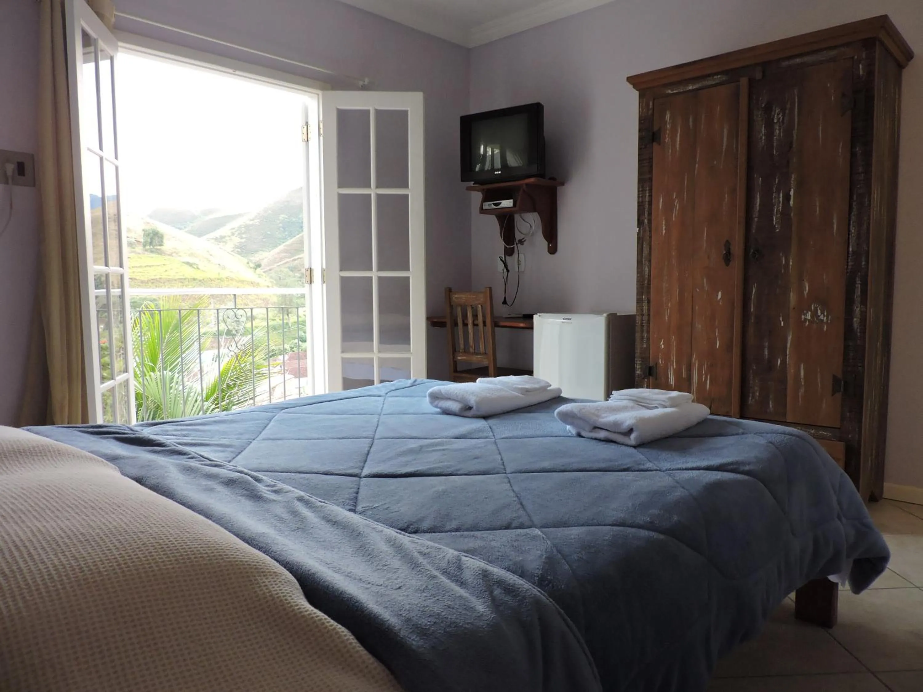Photo of the whole room, Bed in Pousada D'amoras