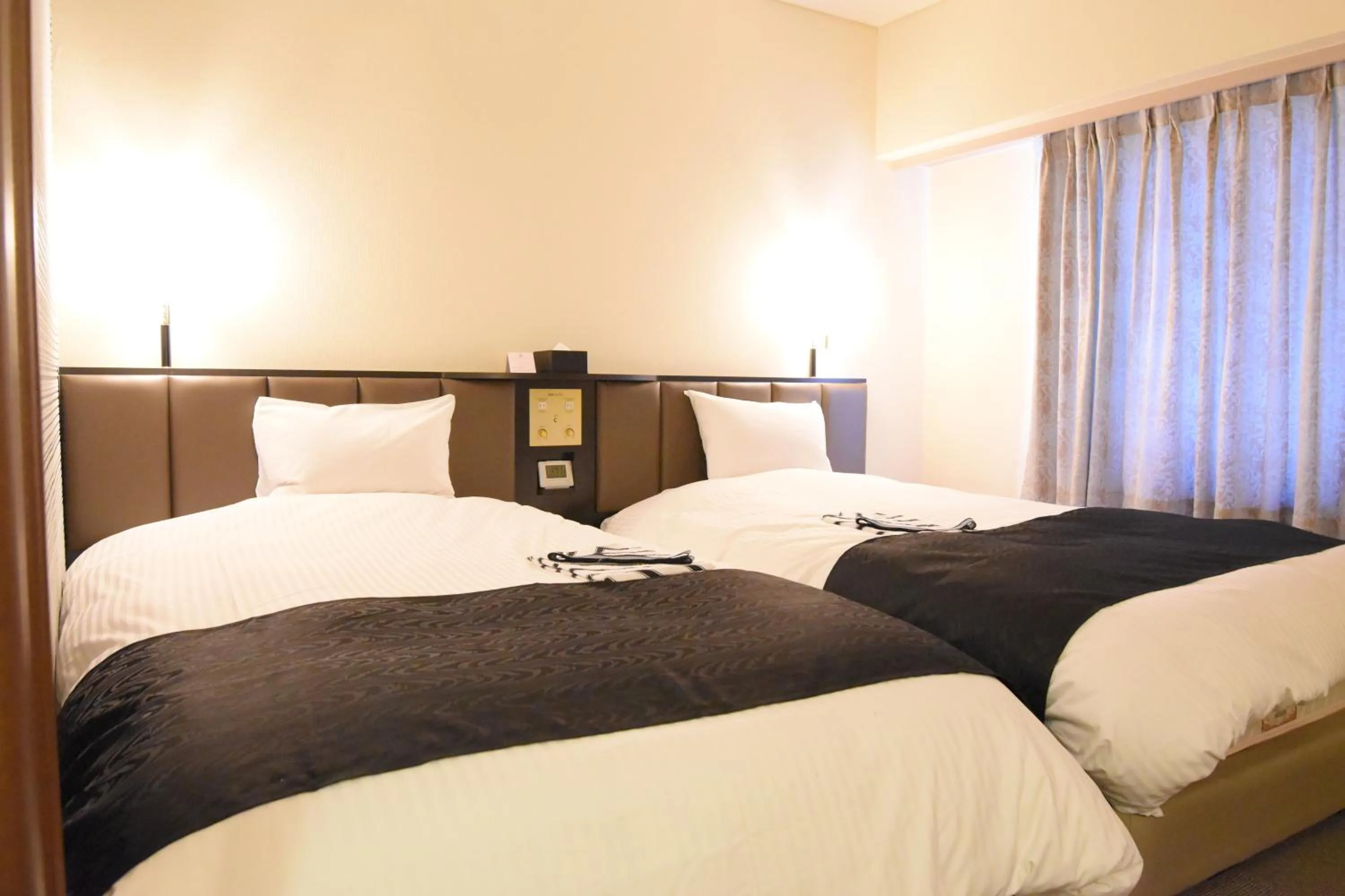 Bed in Apa Hotel Owari Ichinomiya Eki-Mae