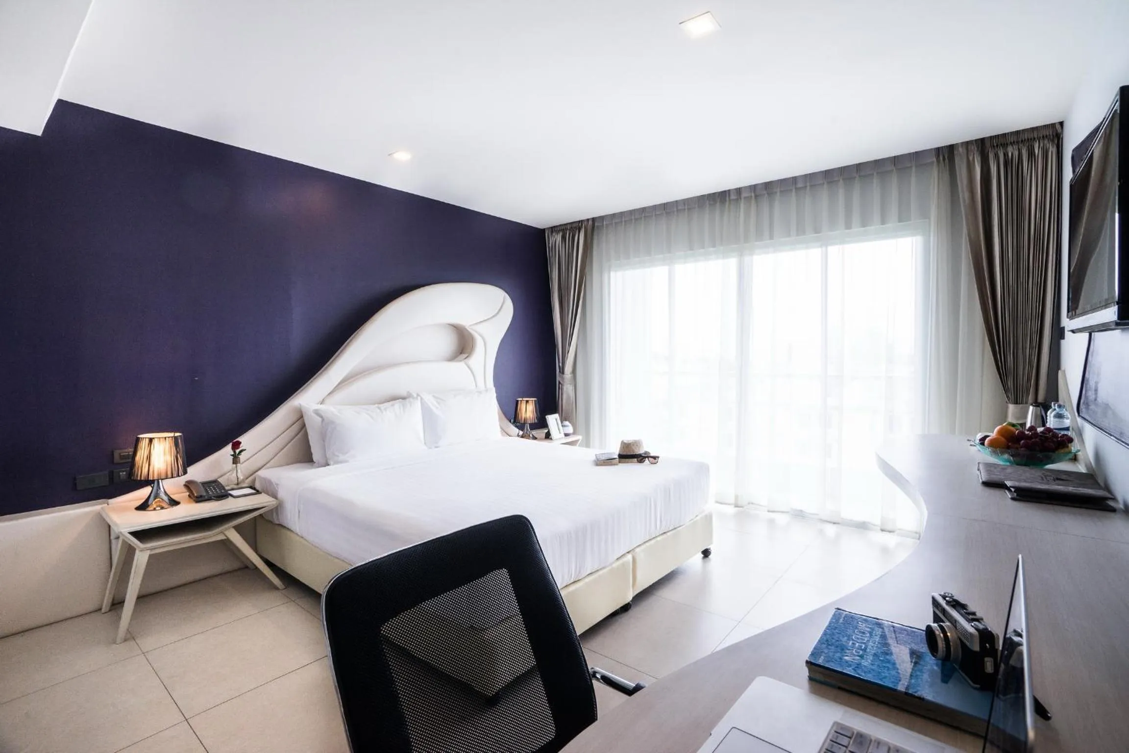 Bed in Blue Boat Hotel JC