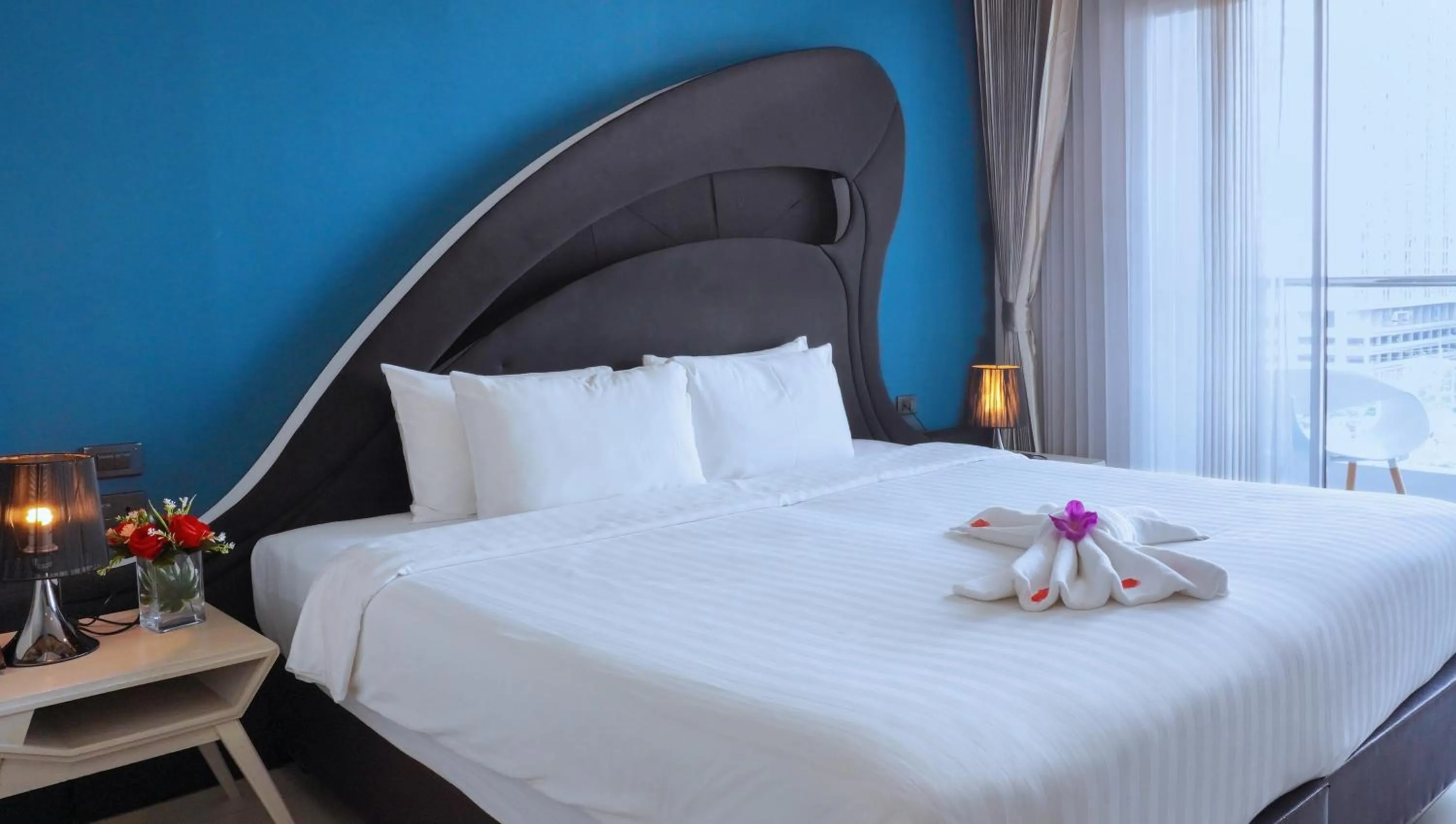 Bed in Blue Boat Hotel JC