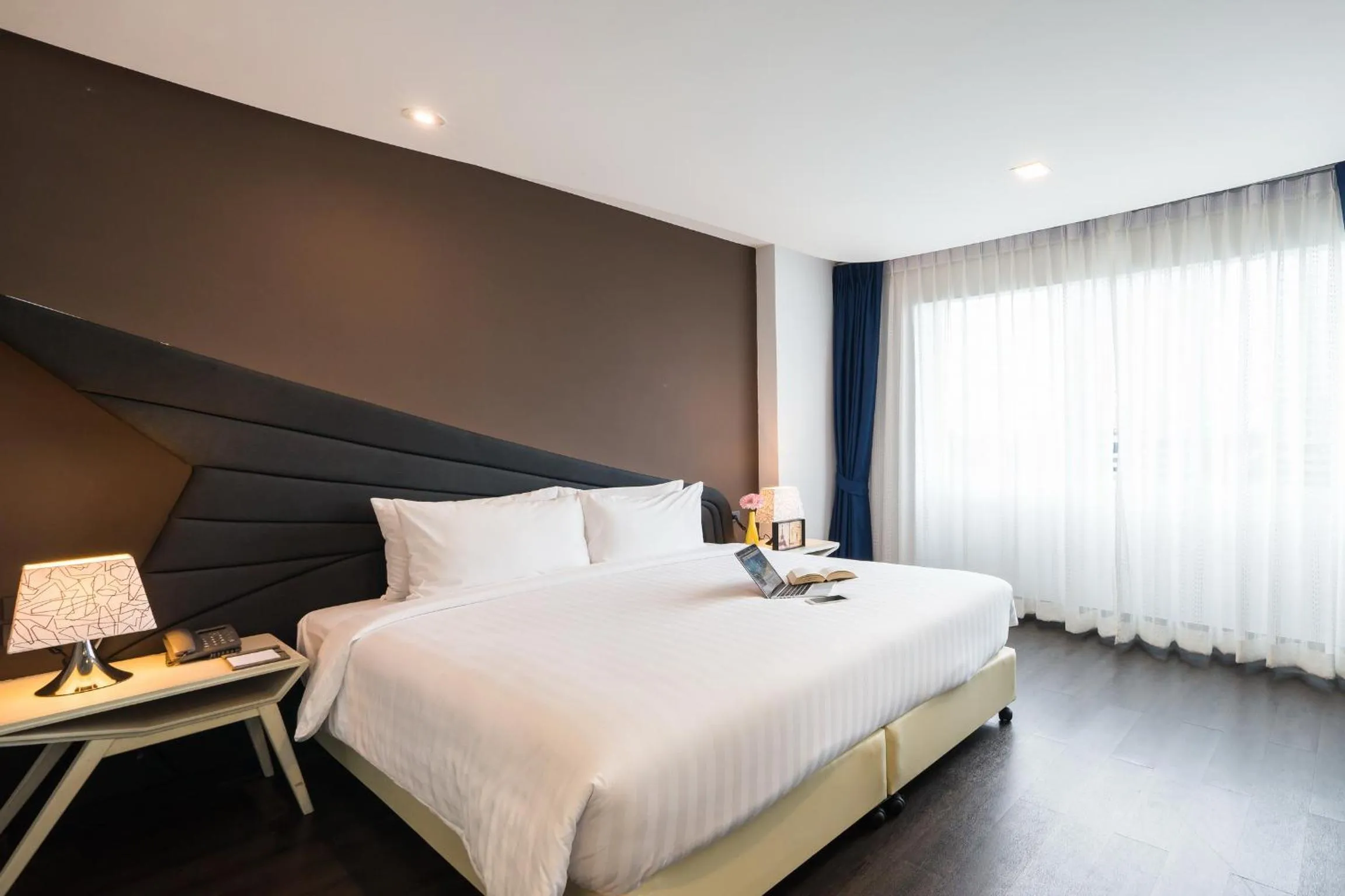 Bed in Blue Boat Hotel JC