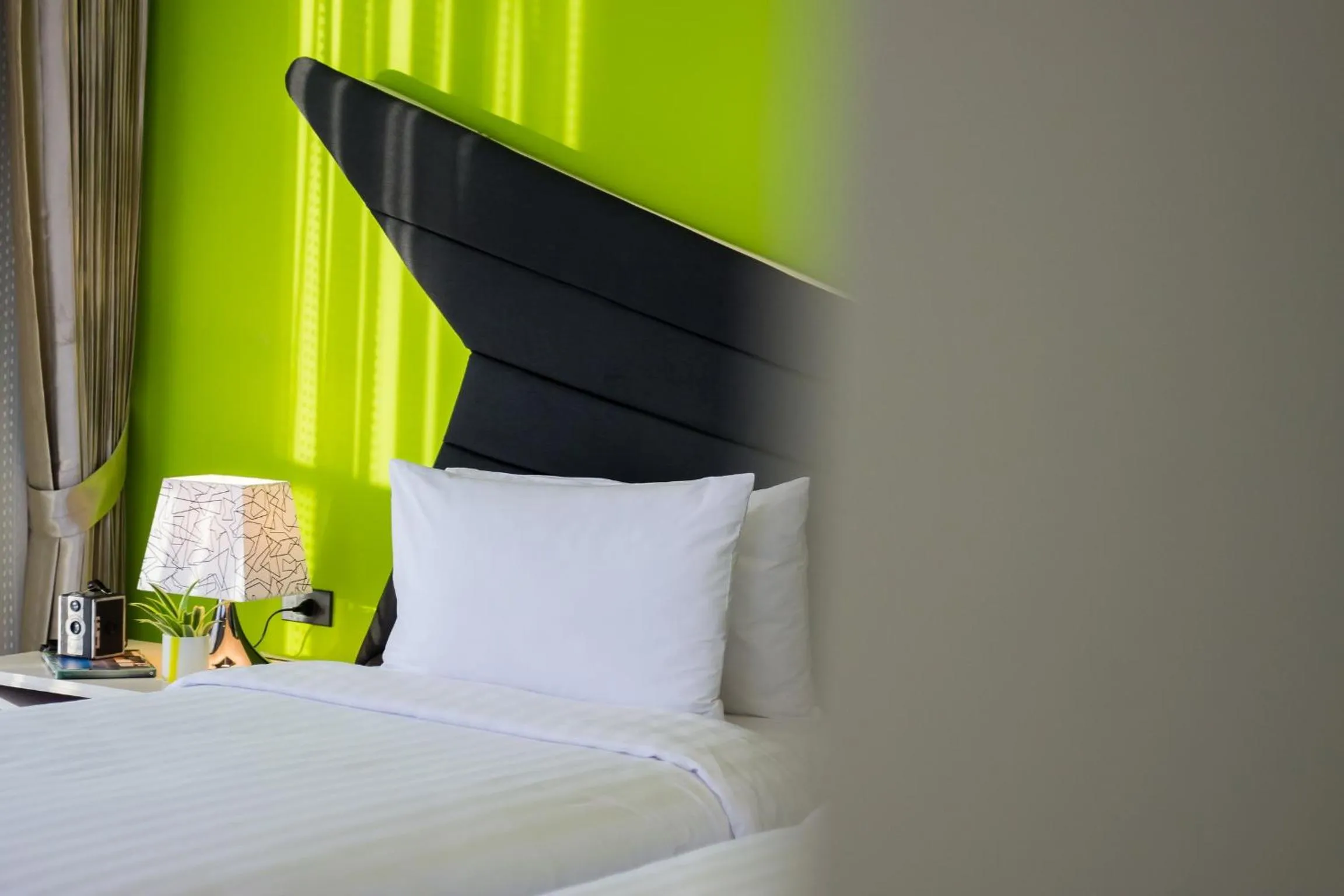 Decorative detail, Bed in Blue Boat Hotel JC